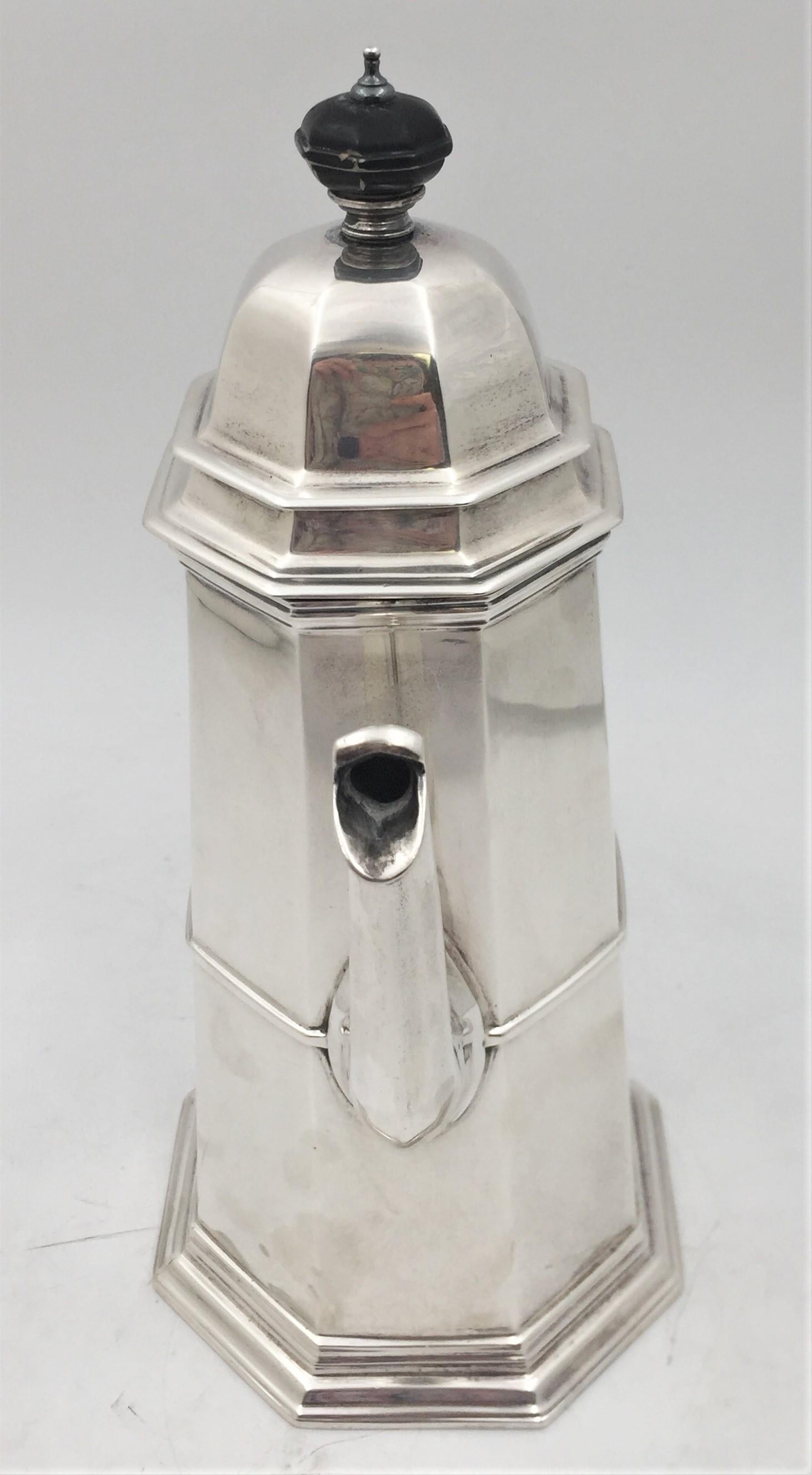 Adie Brothers, English, sterling silver lighthouse coffee pot from 1954. It measures 11 1/2'' in height by 8 3/4'' from handle to spout by 5'' in diameter at the base, weighs 36.9 troy ounces, and bears hallmarks as shown. 

The firm Adie Brothers