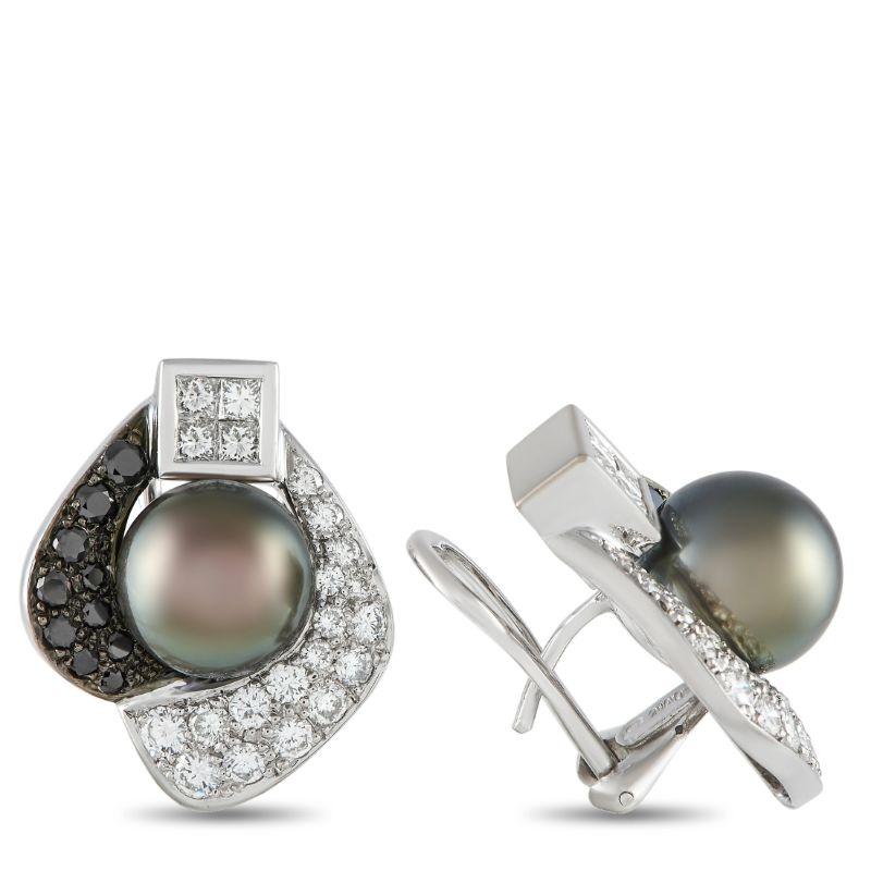 A sophisticated pair of earrings to polish any evening attire. This pair with an omega back closure features a stunning pearl center framed by an elegant swirl of black and white diamonds. Each earring is punctuated by a square bezel housing four