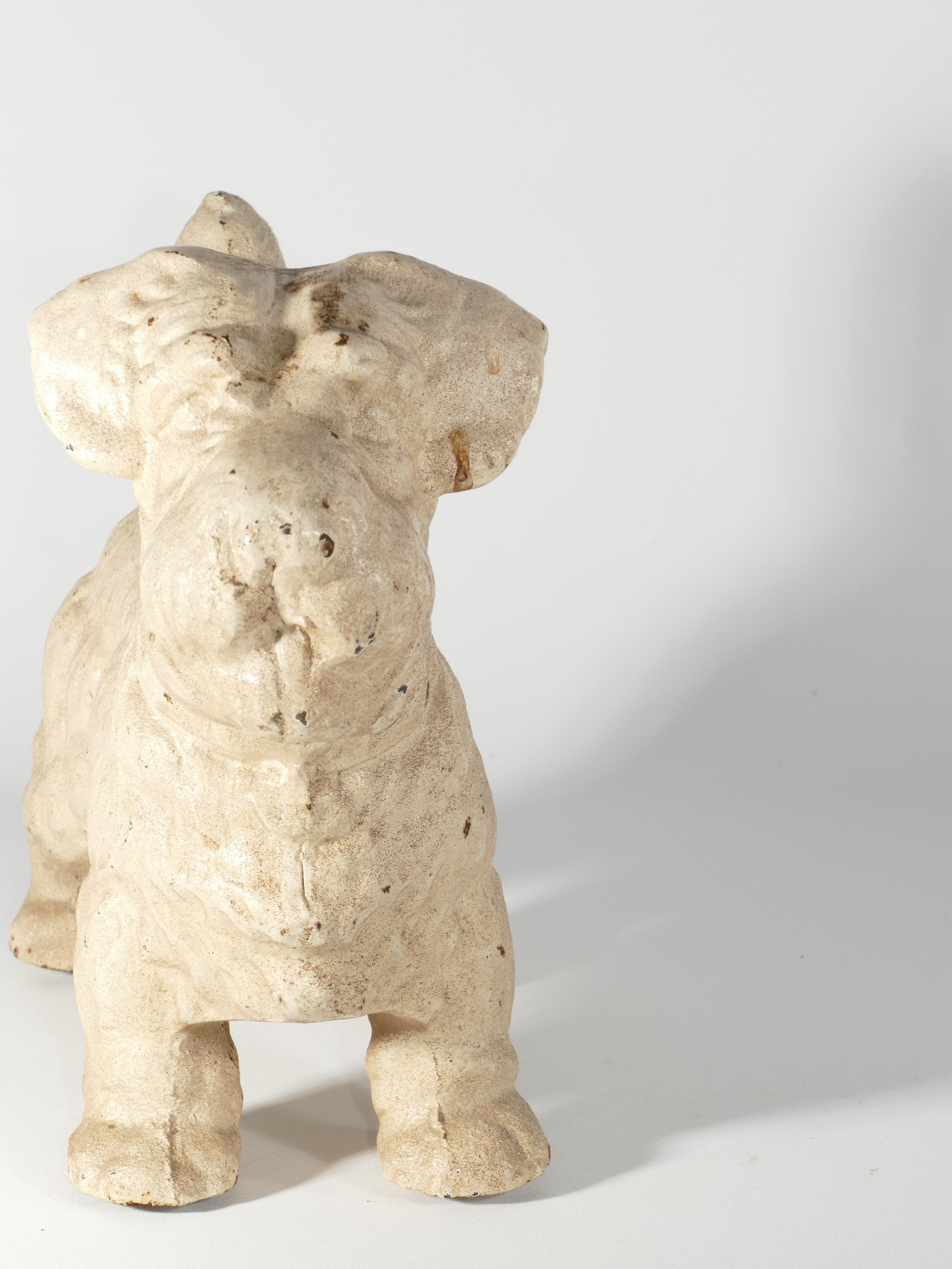 Crafted from durable cast iron, this charming Sealyham Terrier doorstop or sculpture by  Hubley is a delightful addition for any dog enthusiast. With a weight of approximately 7.5kg, it's both sturdy and versatile, suitable for enhancing the decor