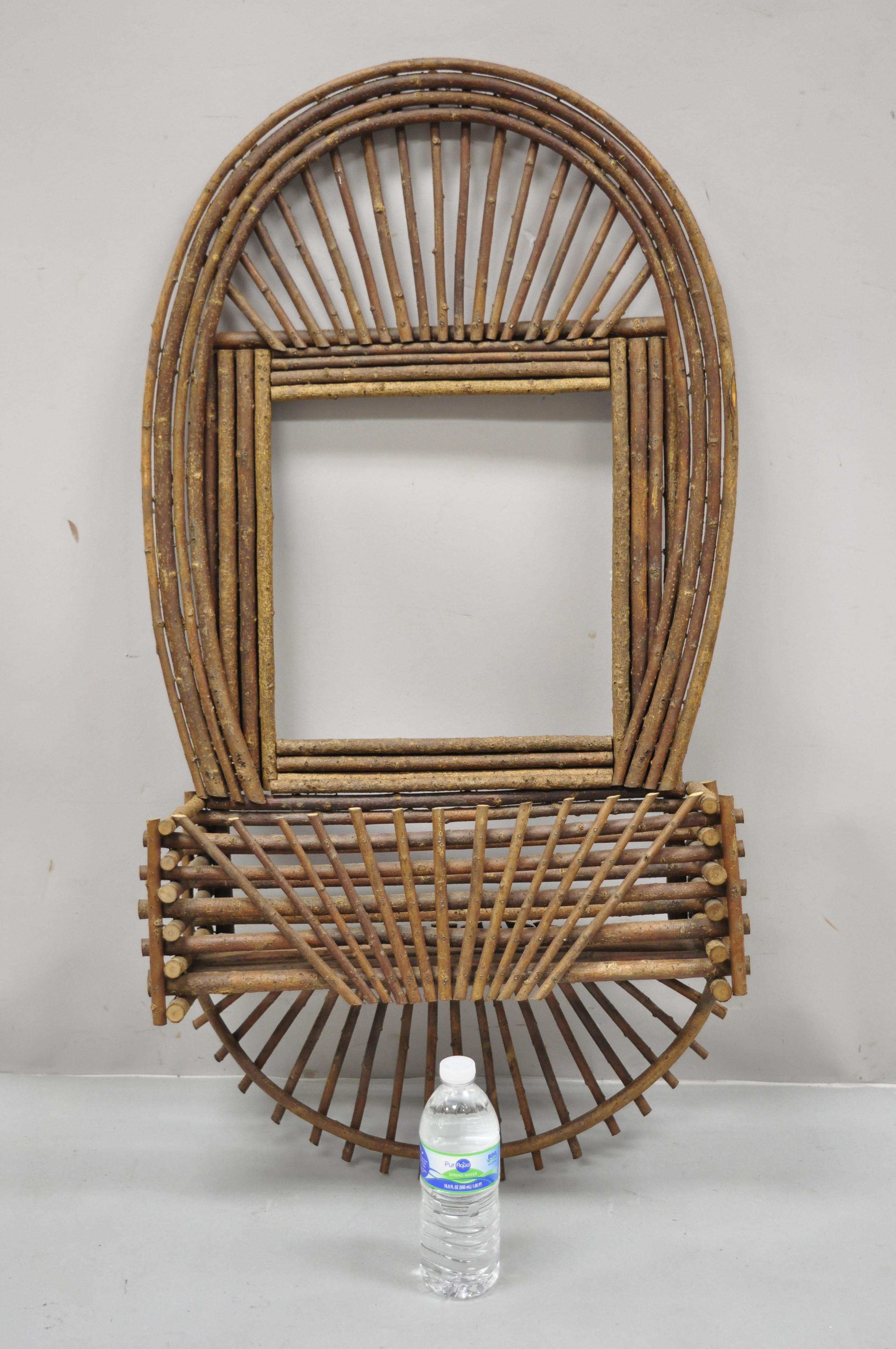 Adirondack Folk Art large twig branch wall shelf planter pocket mirror art frame. Item features handmade sunburst pinwheel frame, wall mounting with storage pocket and open frame, very nice vintage item, great style and form. Great to add a mirror