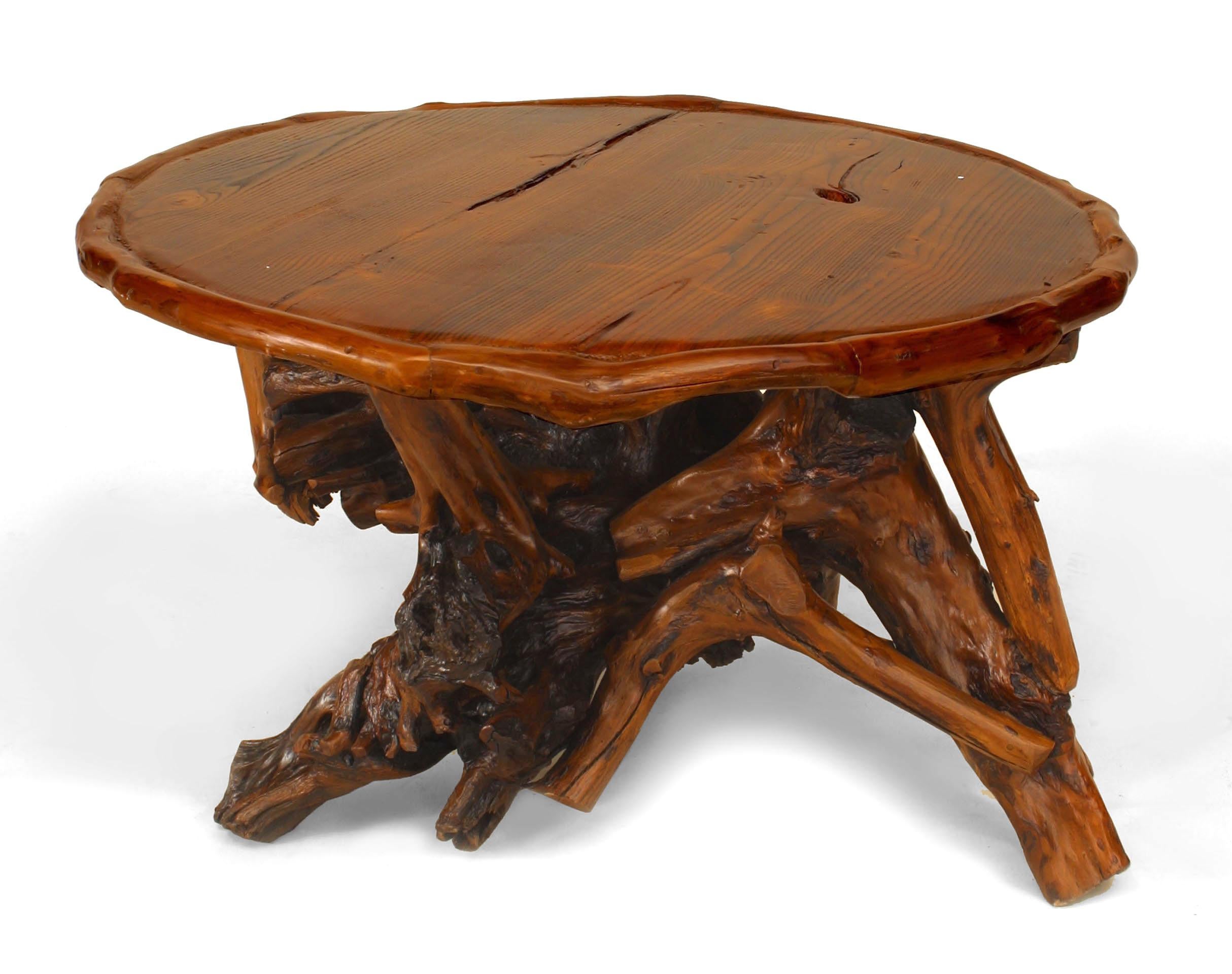 Rustic Adirondack-style (modern) round coffee table with root pedestal bases with 3 legs.
