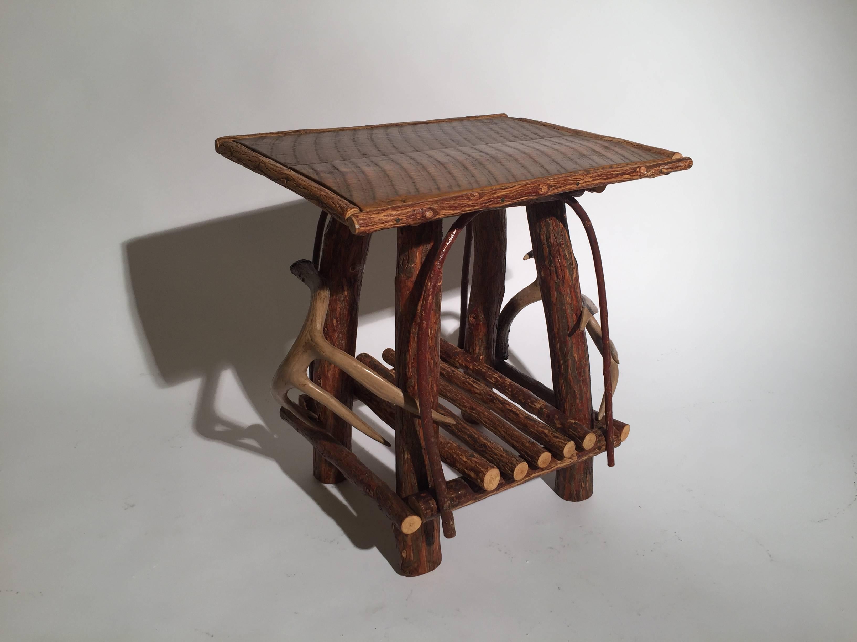 Adirondack style table with horn mounts, great for your lake house.
      