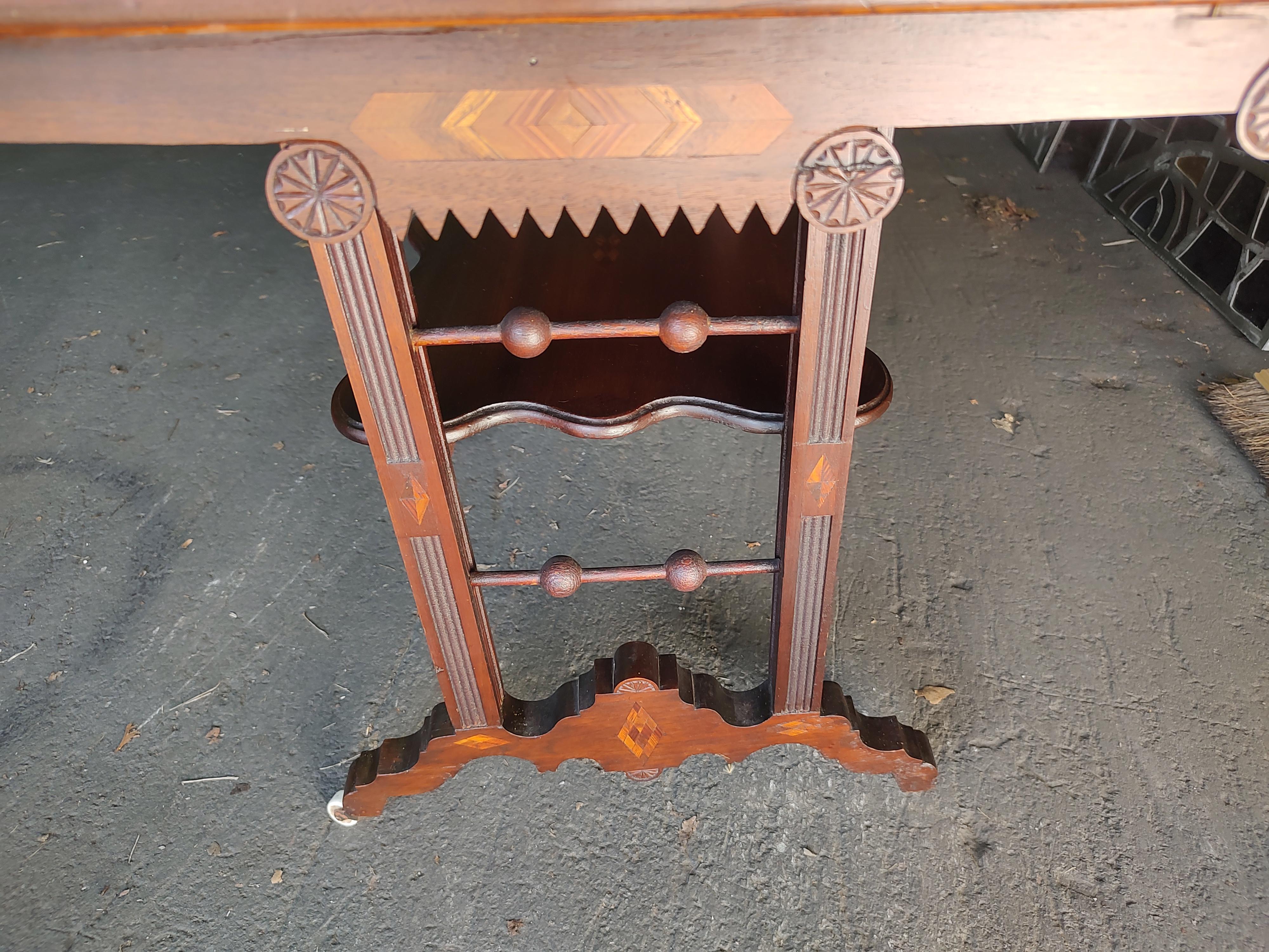 Fabulous and rare to find with this combination of inlay in so many areas of the table. The top is fantastic with it's many designs including stars and diamond banding. The apron and lower table have inlay also. In excellent antique condition with