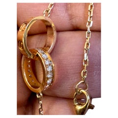 Adjustable 16-18", 18 Karat  Yellow Gold LOVE pendant, half-paved, 5.4 Gm