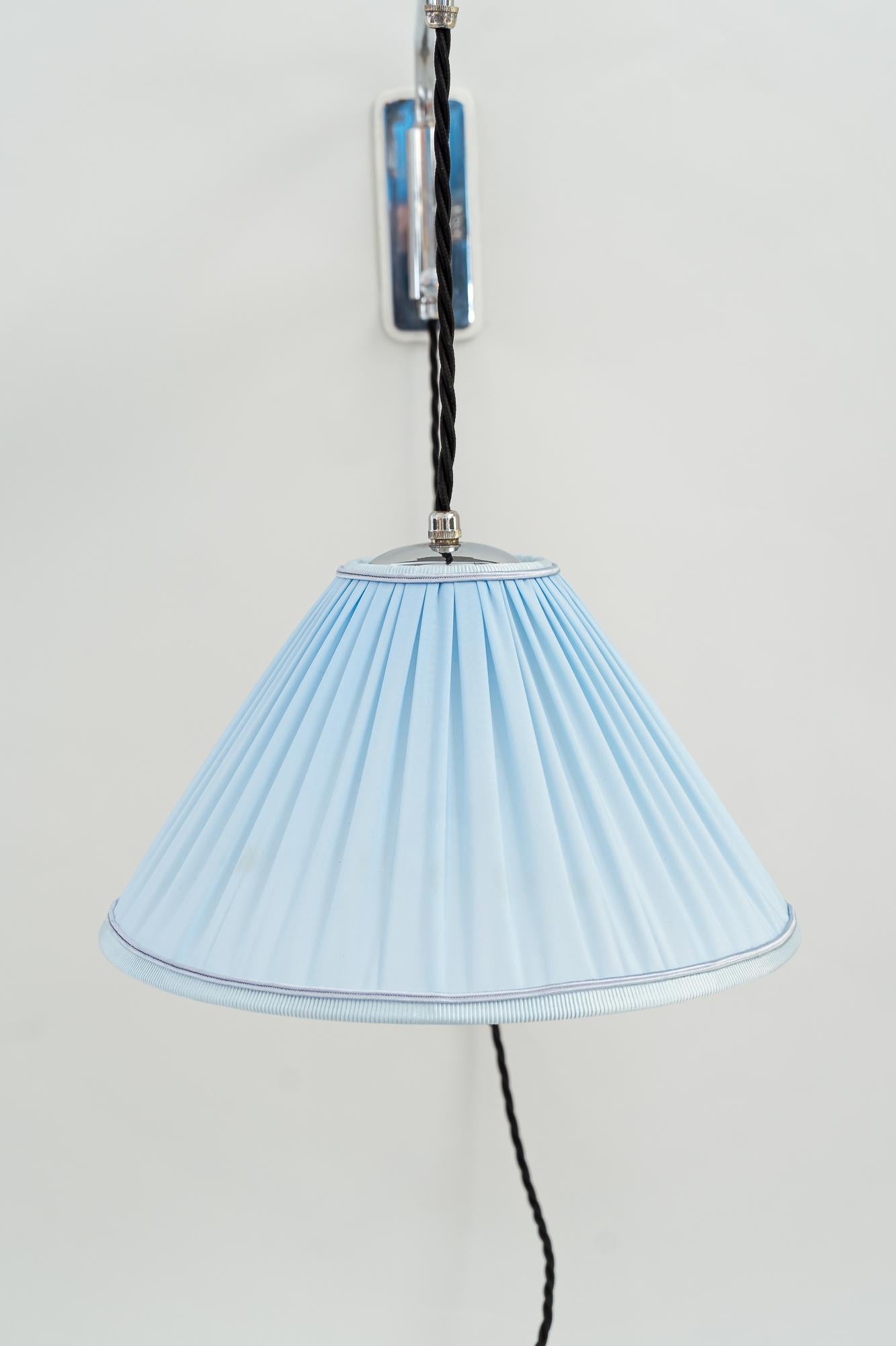 Austrian Adjustable and Swiveling Chrome Wall Lamp with Fabric Shade Around 1920s For Sale