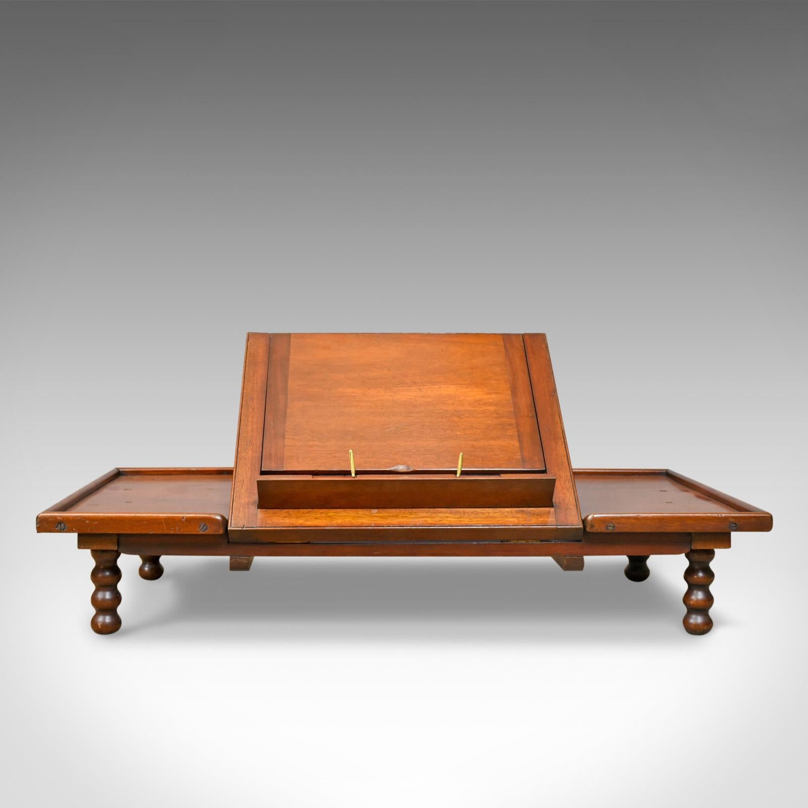 This is an adjustable antique reading table by John Carter, London. A Victorian, mahogany 'Literary Machine' lectern dating to the late 19th century, circa 1890.

In fine order, the mahogany displays good, consistent color
The quality stocks with