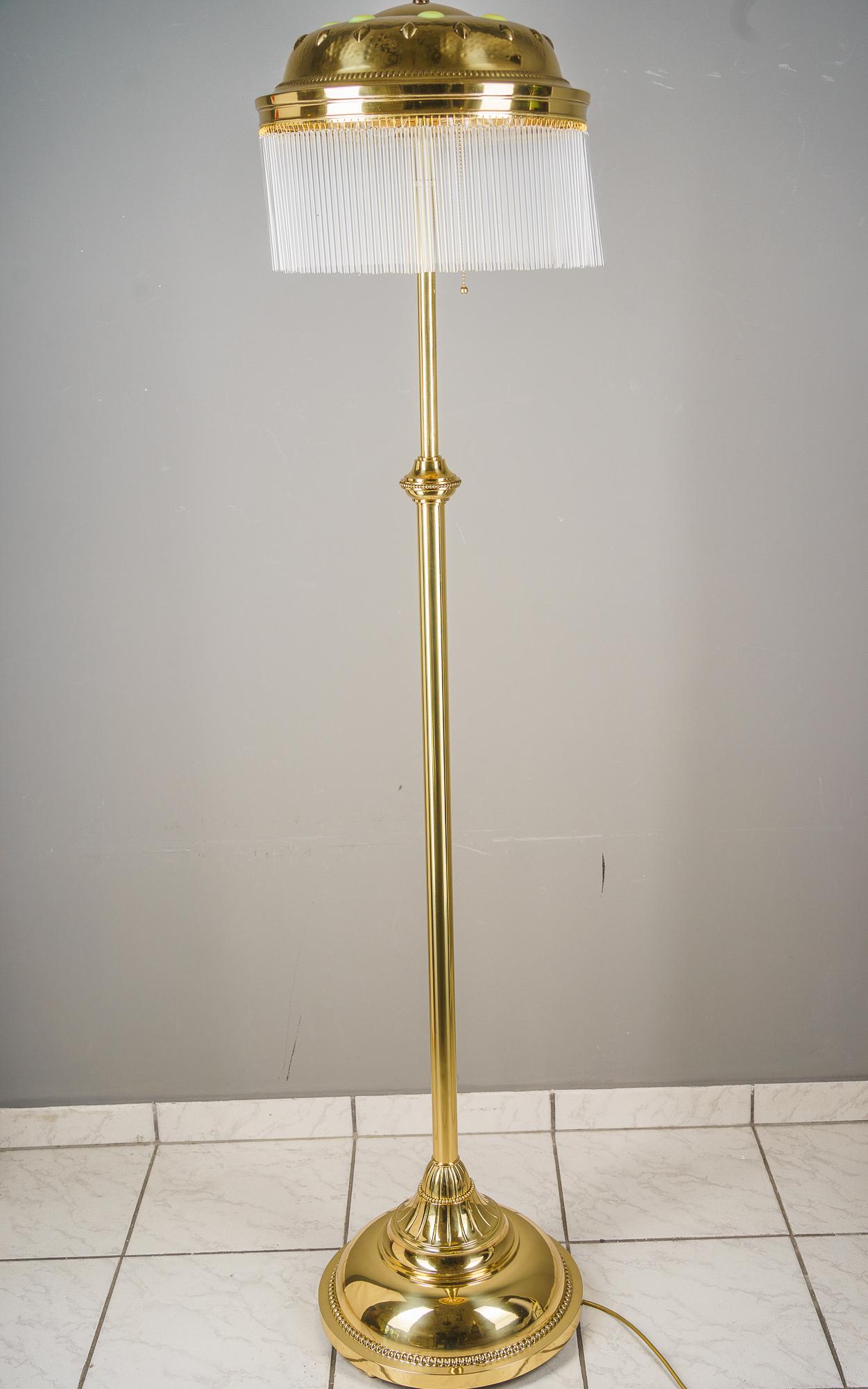 The hight is adjustable from 141cm up to 175cm
Brass polished and stove enameled
Original opaline glass stones on the shade
The glass sticks are replaced ( new )
