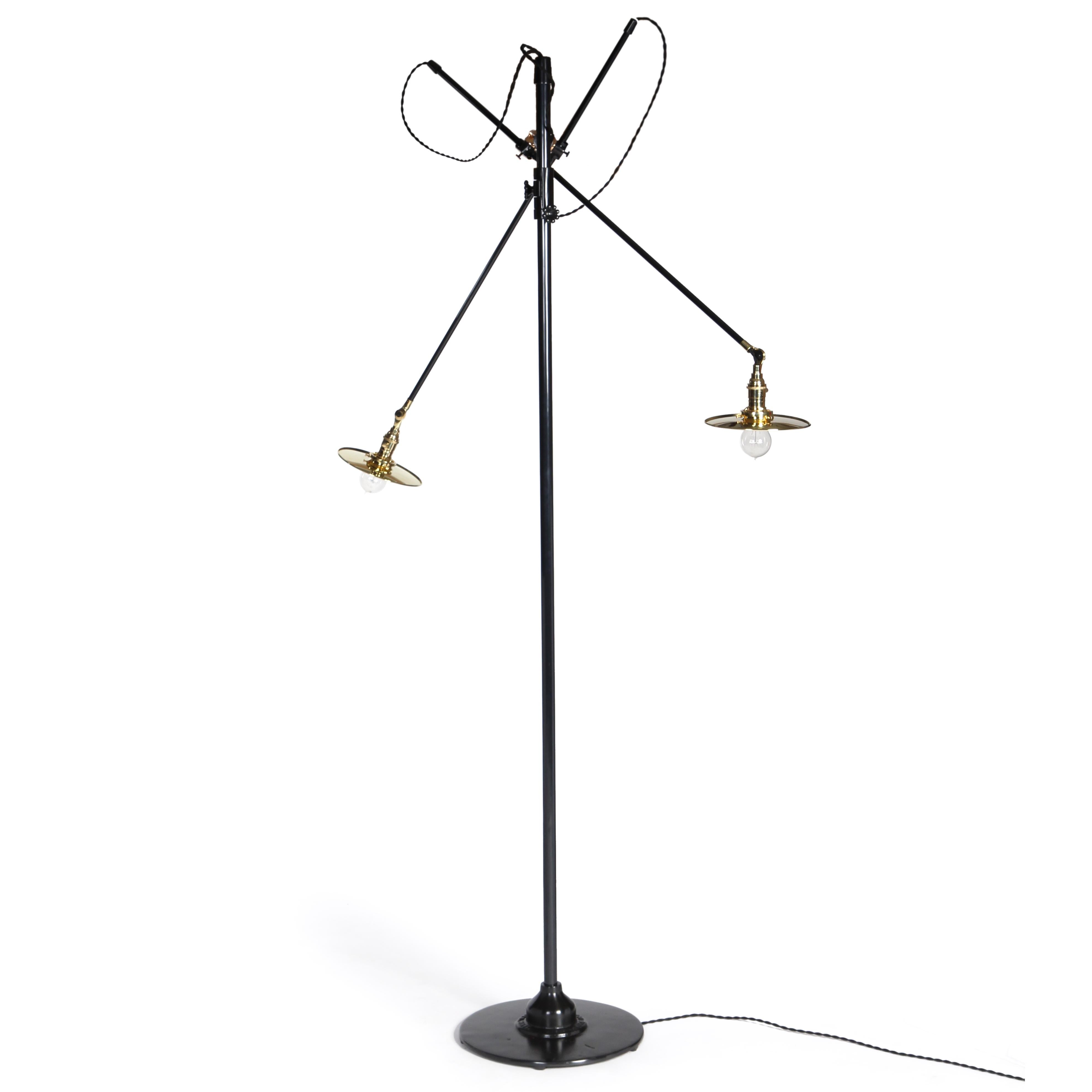 O.C. White designed adjustable floor lamp in patinated steel and polished brass flat shades. Two articulating arms mounted to one adjustable arm. Supported by a stepped disc base. Manufactured in the USA, customized by the WYETH Workshop in NY.