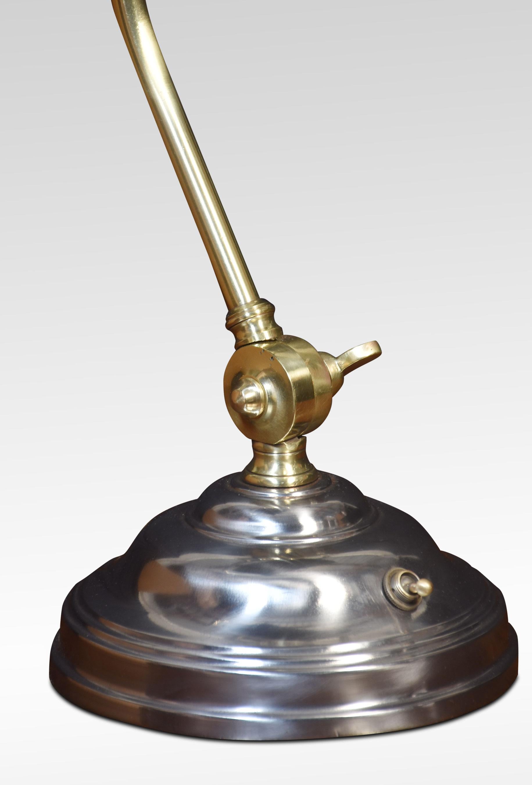 Adjustable Bankers desk lamp, the silvered circular stepped base and brass pivoted sweeping arm supporting adjustable lampshade. The lamp has been rewired.
Dimensions
Height 15.5 Inches
Width 12 Inches
Depth 10 Inches.