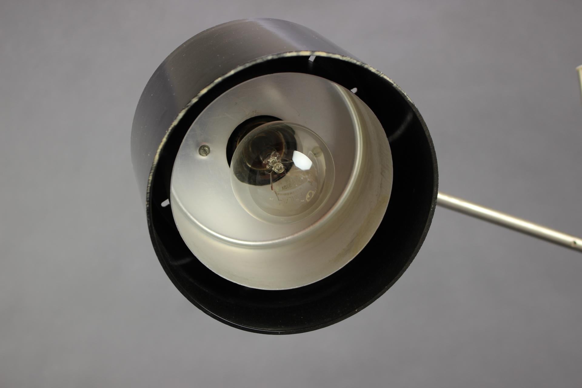 - Adjustable Black Bakelite Industrial Table Lamp / Czechoslovakia, 1970s,
- made of Metal and Bakelitte,
- in highest dimension 90cm,
- shows signs of wear and age (scratches, etc.),
- In original good condition