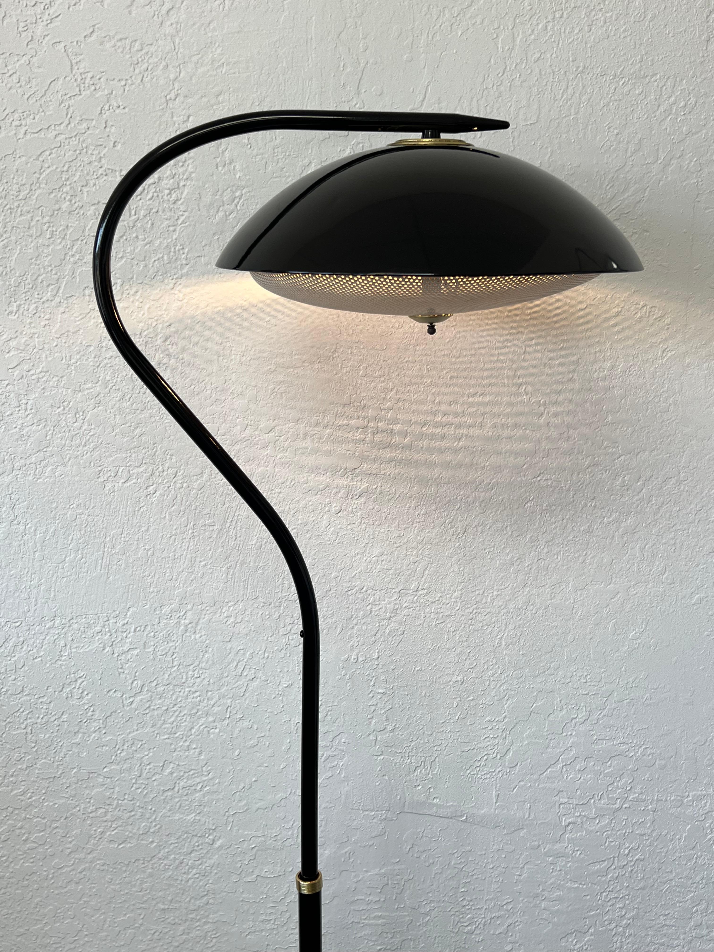 Mid-Century Modern adjustable floor lamp. Circa 1950’s. 
Newly powder coated black with satin brass details. Rewired for US, It takes two 75W Max lite bulbs. 

Measurements: 
19” Wide, 14” Deep, 49.5” High when all the way up and 39.5” High when all