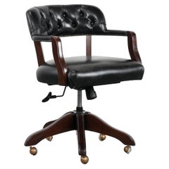 Adjustable black timeless Chesterfield office chair made of cow leather