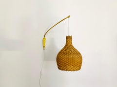 Adjustable Brass and Wicker Arc Sconce