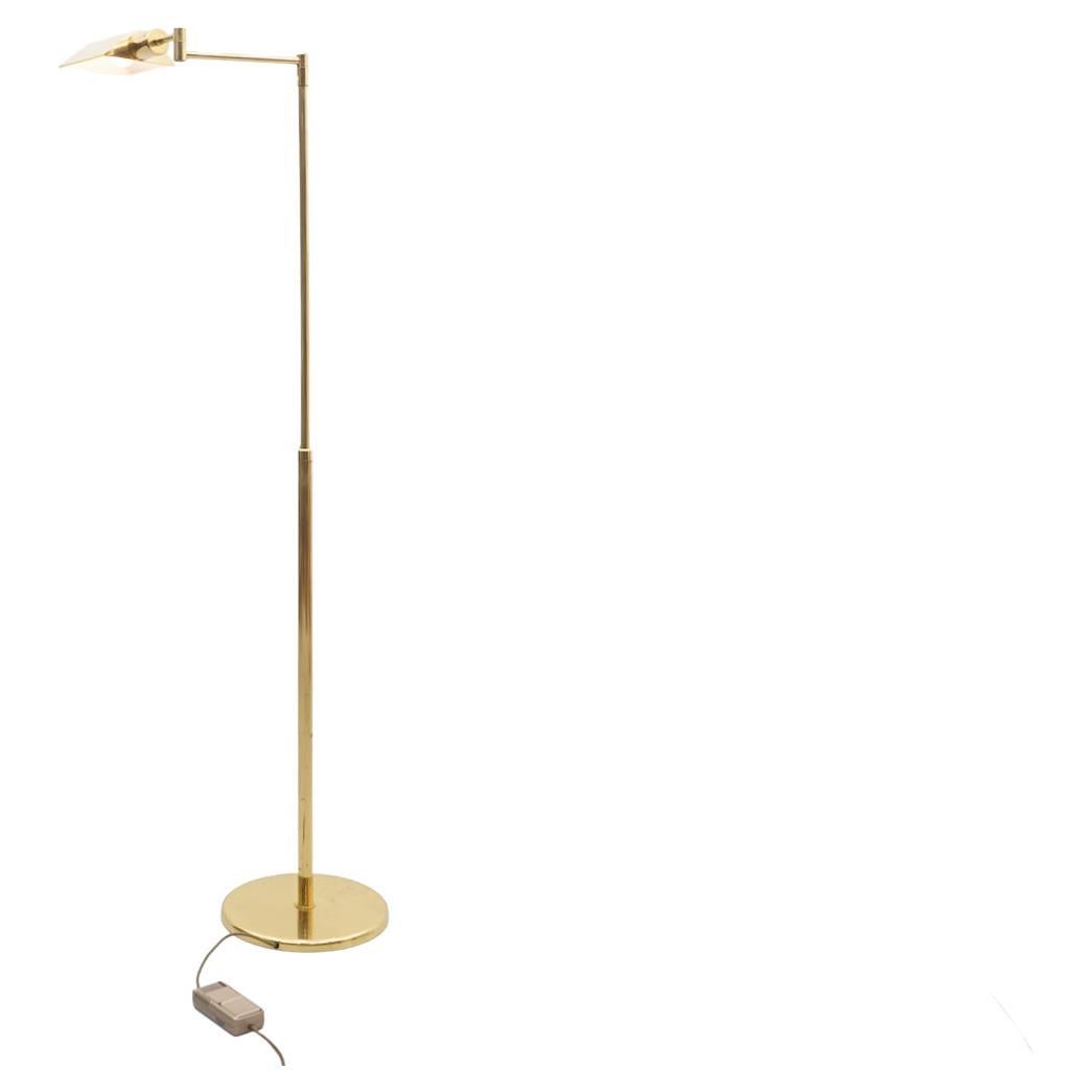 Height-adjustable floor lamp with swivel brass arm. The lamp has a dimmer and requires a light bulb with an E27 socket.

Good original condition.
Details

Creator: unknown
Period: 1970s
Color: Gold
Style: Mid-Century Modern
Place of Origin: