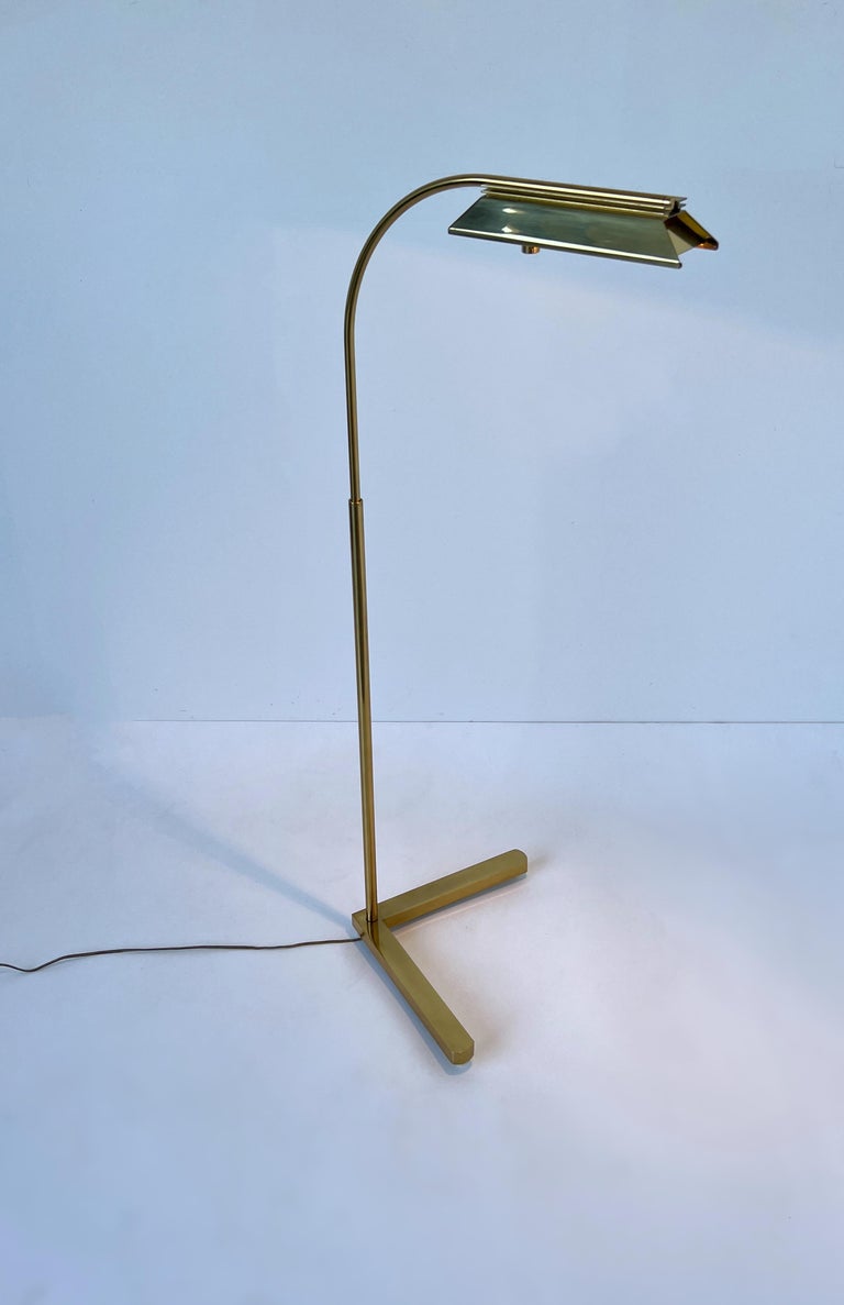 1970’s Ajustable polished brass floor lamp by Casella.
In beautiful vintage condition, shows minor wear consistent with age. 
It has a full range control dimmer, 100w max halogen bulb. 
It rotates 360 and it goes up and down. 
Measurements: Max