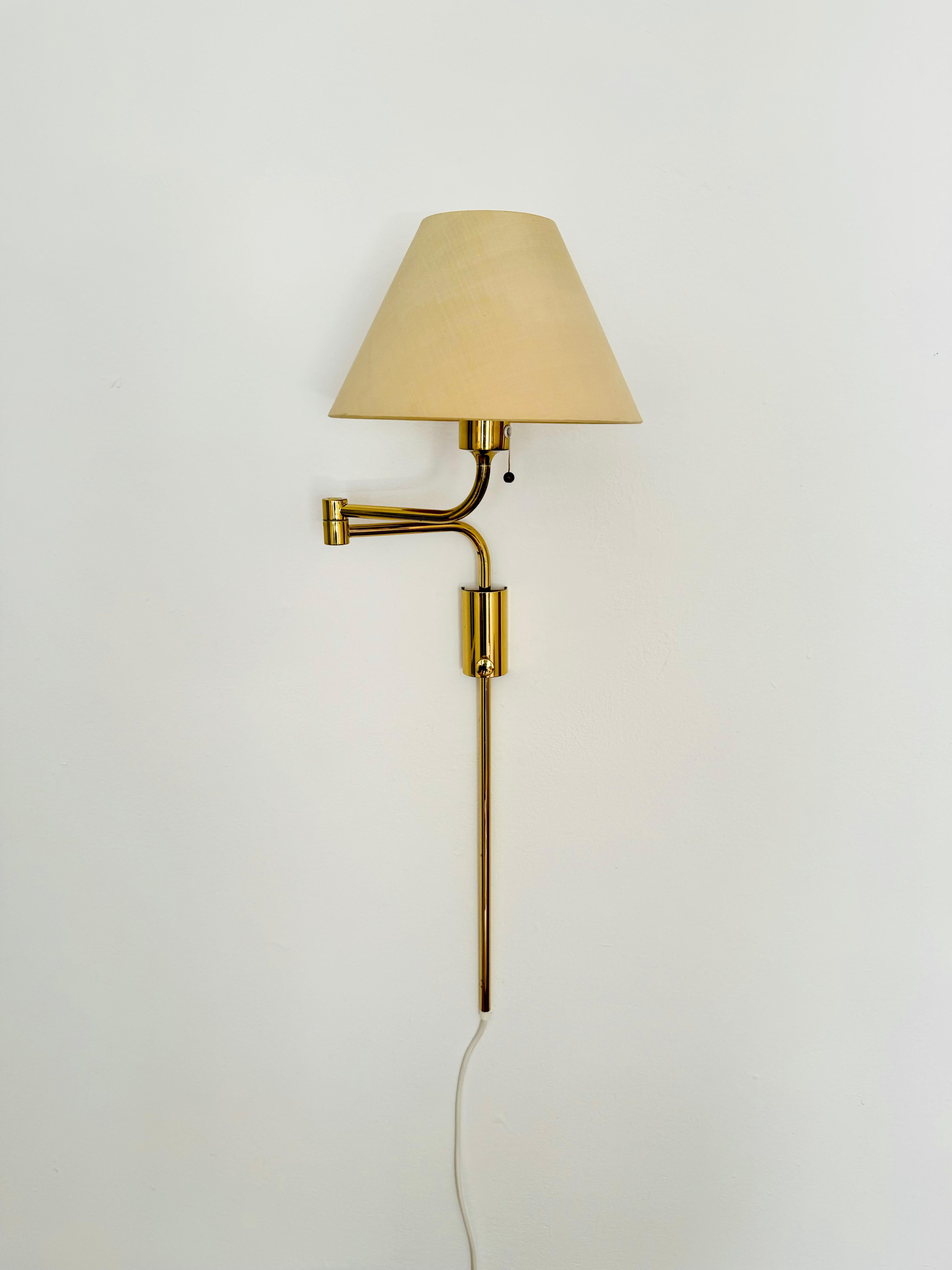 Very nice height-adjustable brass wall lamp from the 1970s.
The design and the very beautiful details create a very elegant and pleasant light.
The lamp creates a very cozy atmosphere and is very high quality.
Infinitely adjustable.
The lamp can be