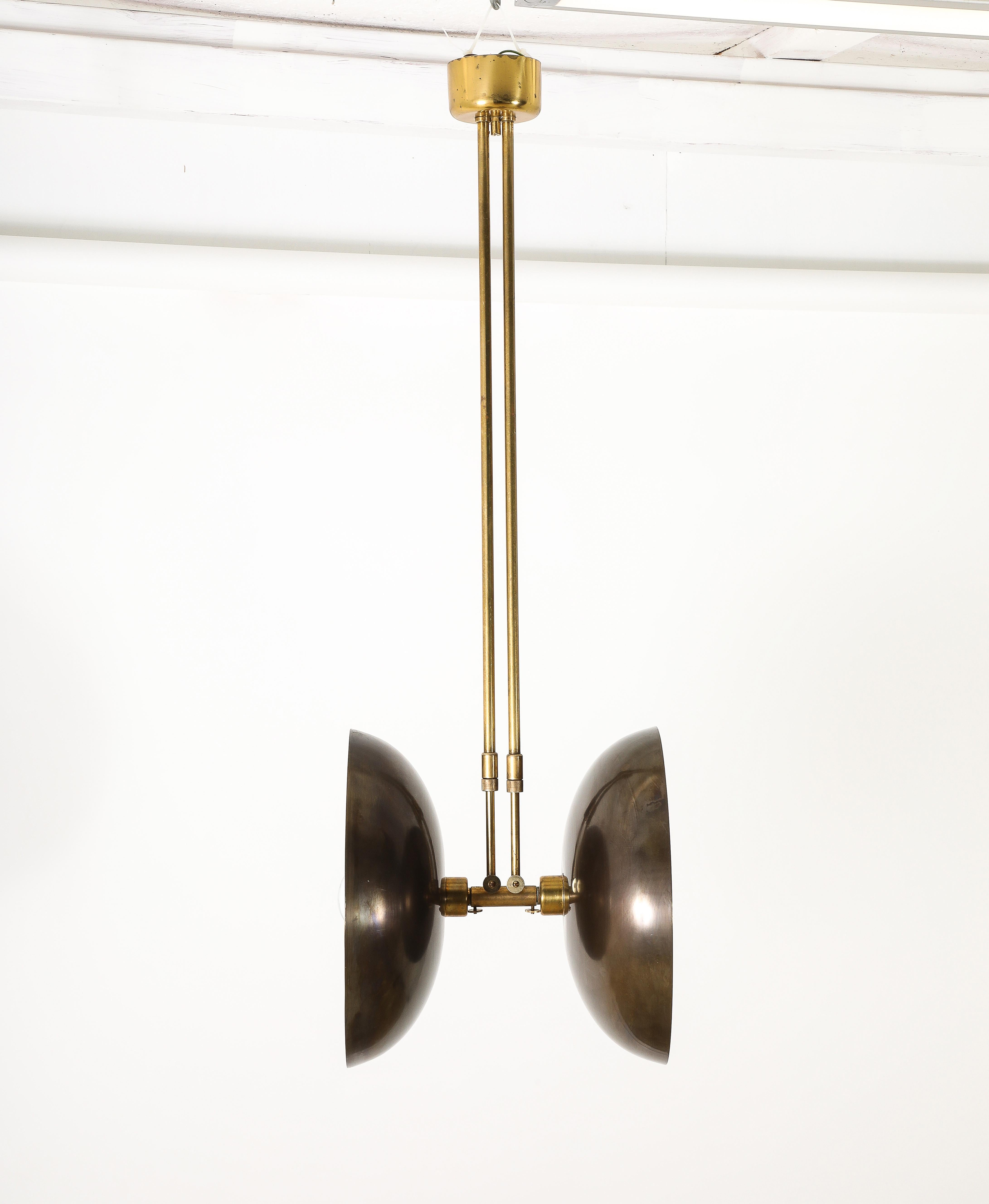 Graphic pendant with double shades, it adjusts up and down from 36 inches to about 55.