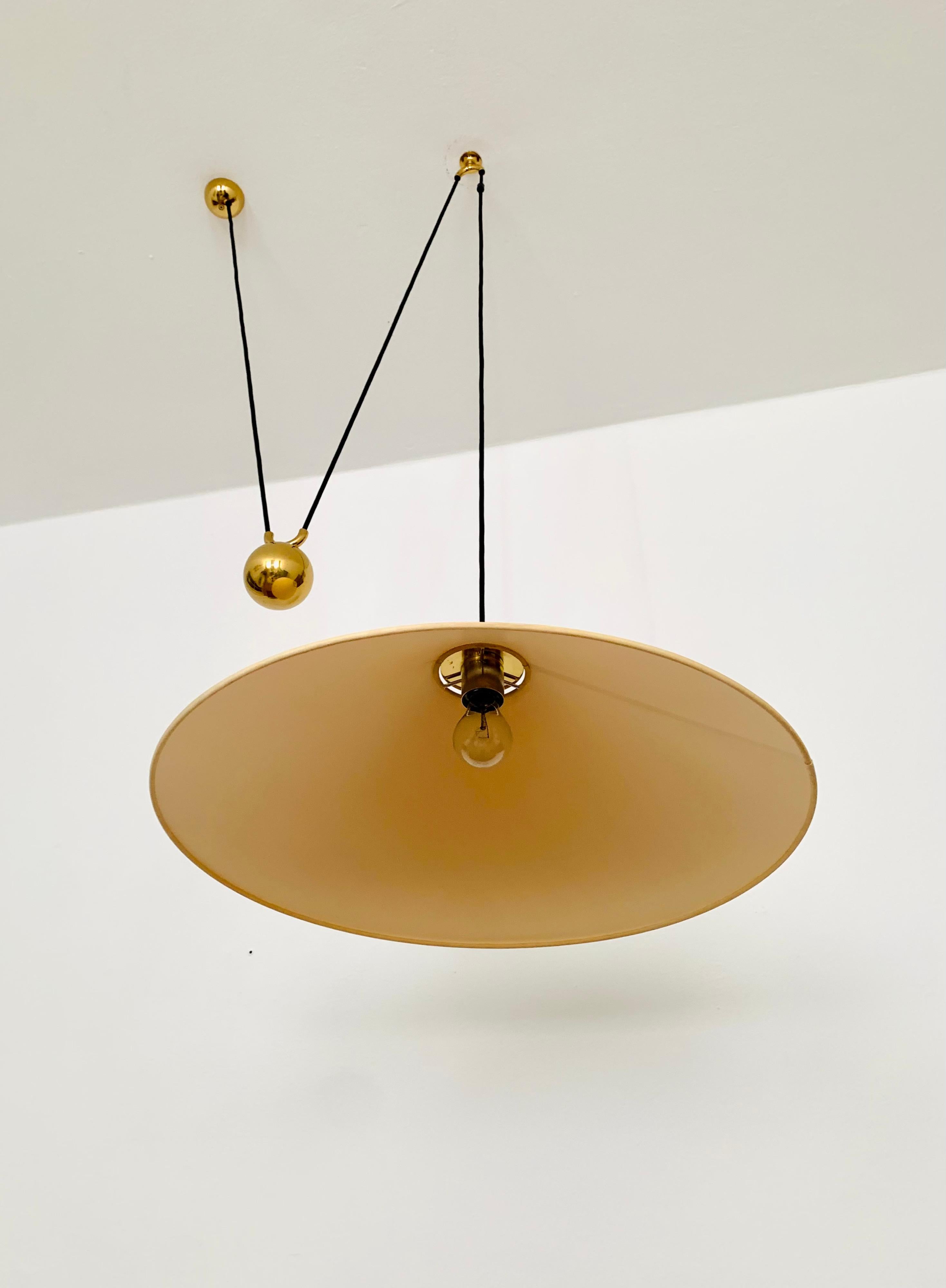 Adjustable Brass Pendant Lamp with Counterweight by Florian Schulz For Sale 1