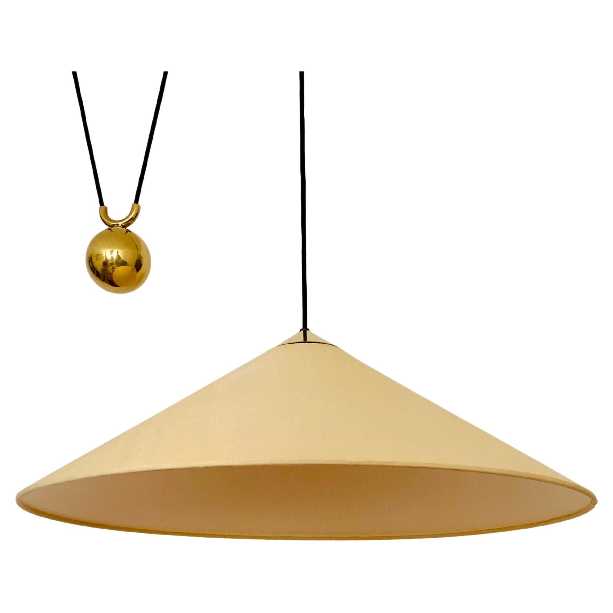 Adjustable Brass Pendant Lamp with Counterweight by Florian Schulz For Sale