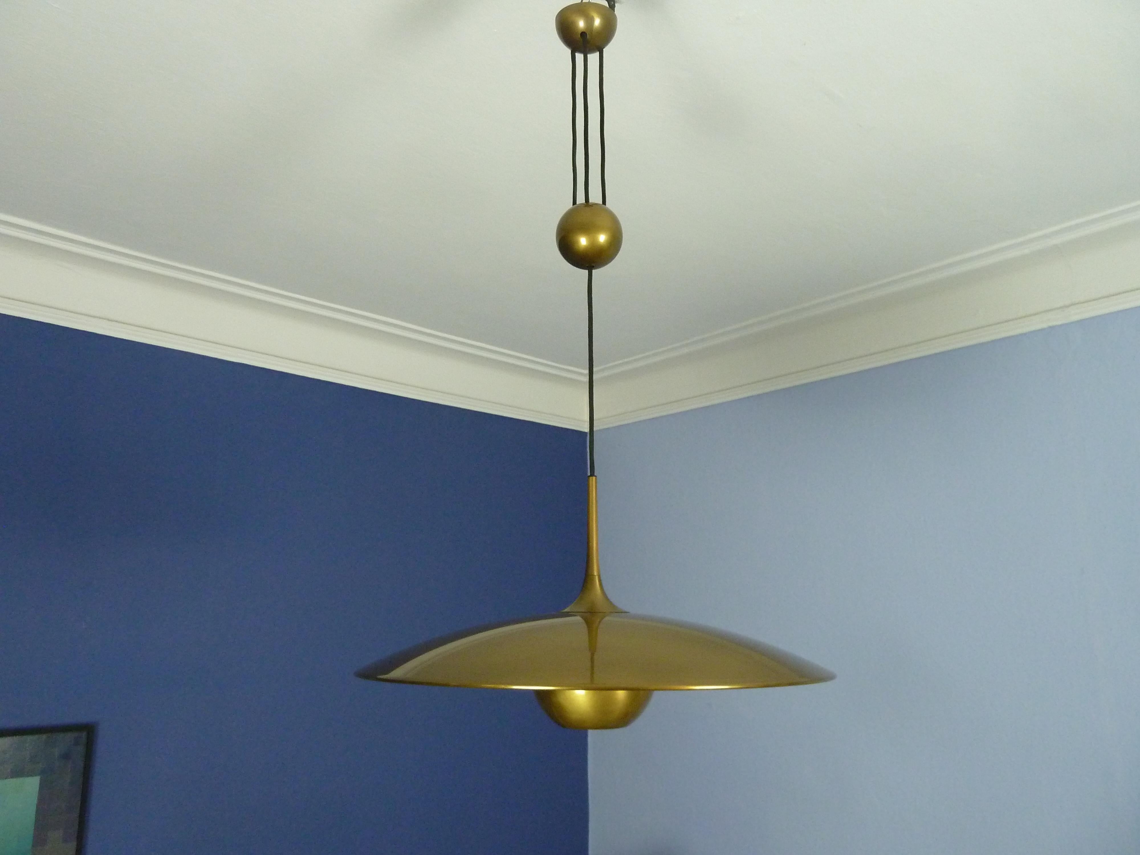 German Adjustable Brass Pendant Onos55 by Florian Schulz with a Central Counterweight