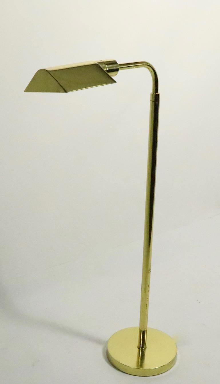 Adjustable brass pharmacy lamp by JPF Mendizabal for Industria Argentinia this floor lamp is adjustable in height (Highest position 52.5, lowest position 39 inches). Original, clean and working condition, accepts standard size screw in bulb. Very