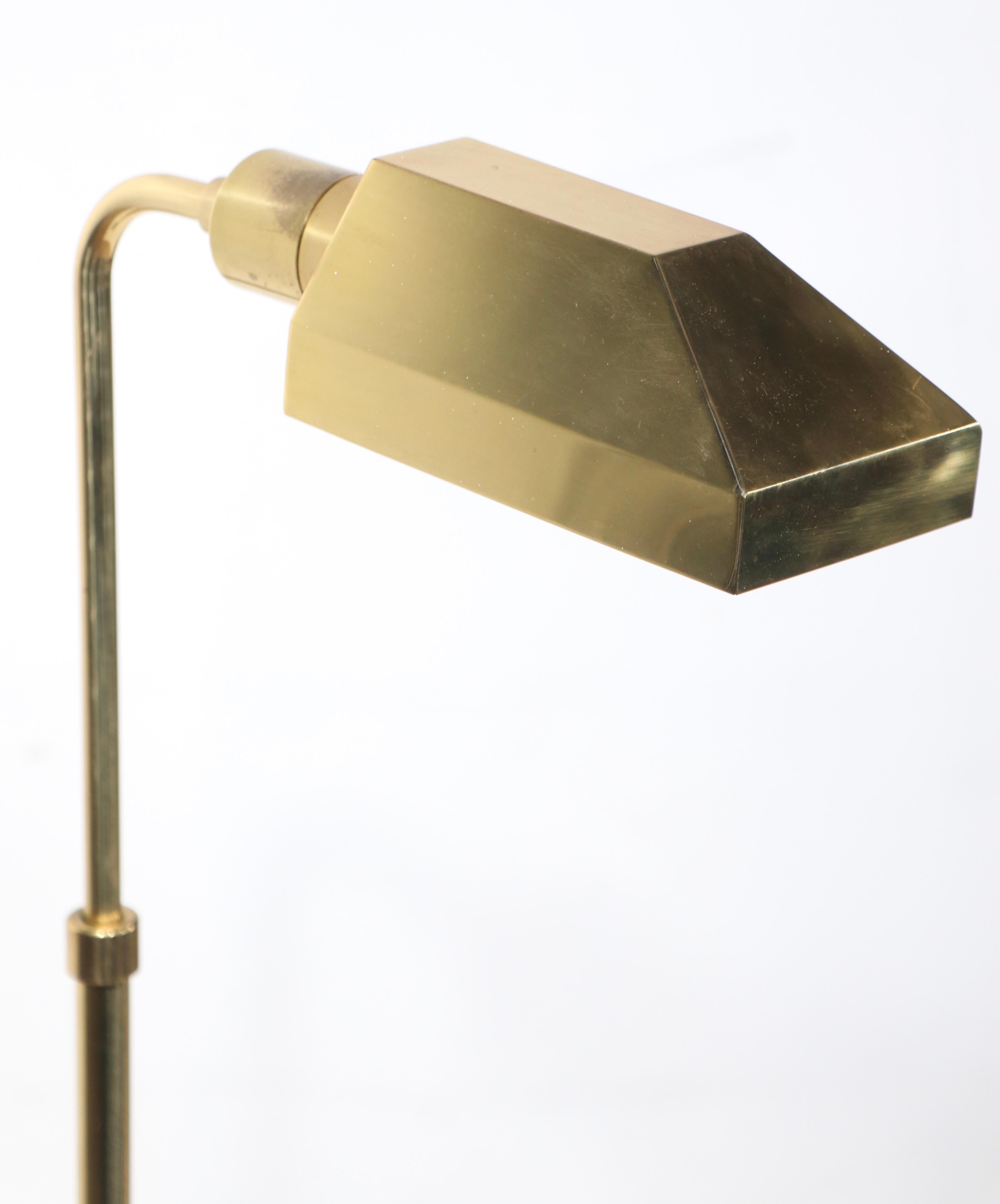 Classic Post Modern reinterpretation of the antique Pharmacy Lamp form, attributed Koch & Lowey circa 1970's. The lamp is constructed of solid brass, having an angular hood shade which swivels on the socket, to direct to light, the vertical pole is