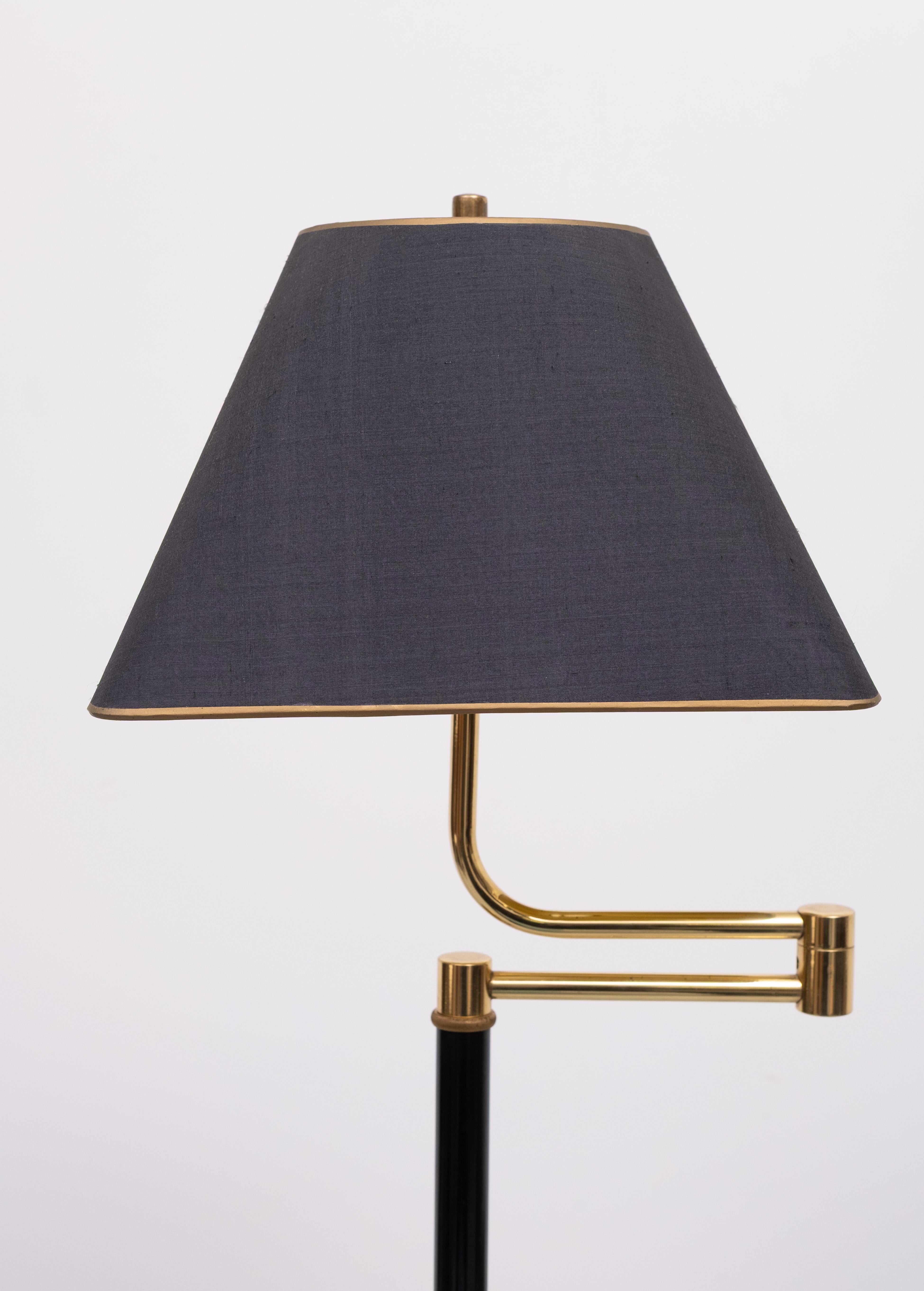 Very nice  adjustable in Height ,Swing arm floor lamp.
Beathiful shaped feet . Comes complete with its matching Shade . 
foot switch .
   Please ask for better chipping solutions .