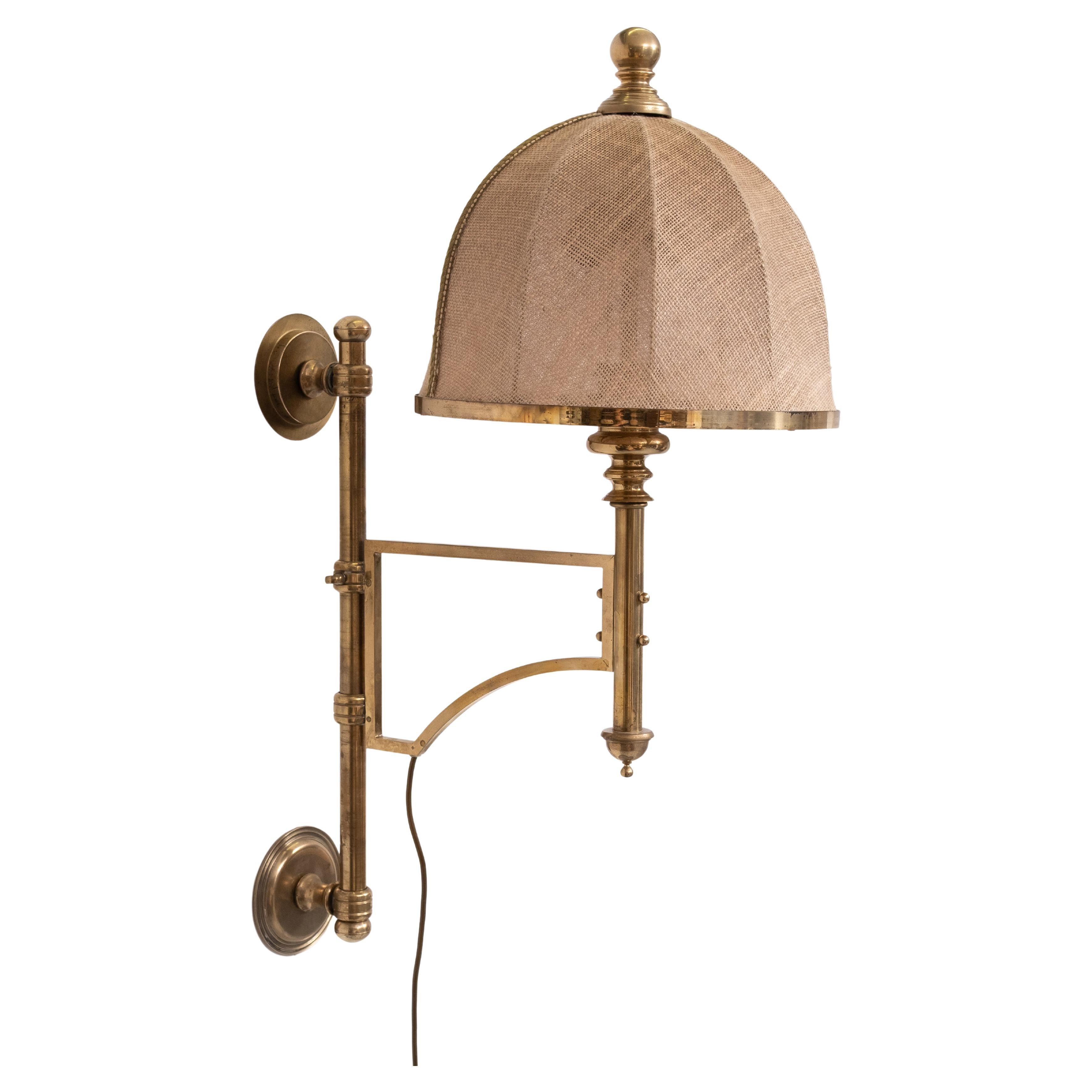 Unique  Brass Wall lamp ,adjustable in Height and turn able .
Very heavy Lamp .comes with its original Hessian Shade .                                 3 large E27 bulbs needed . 