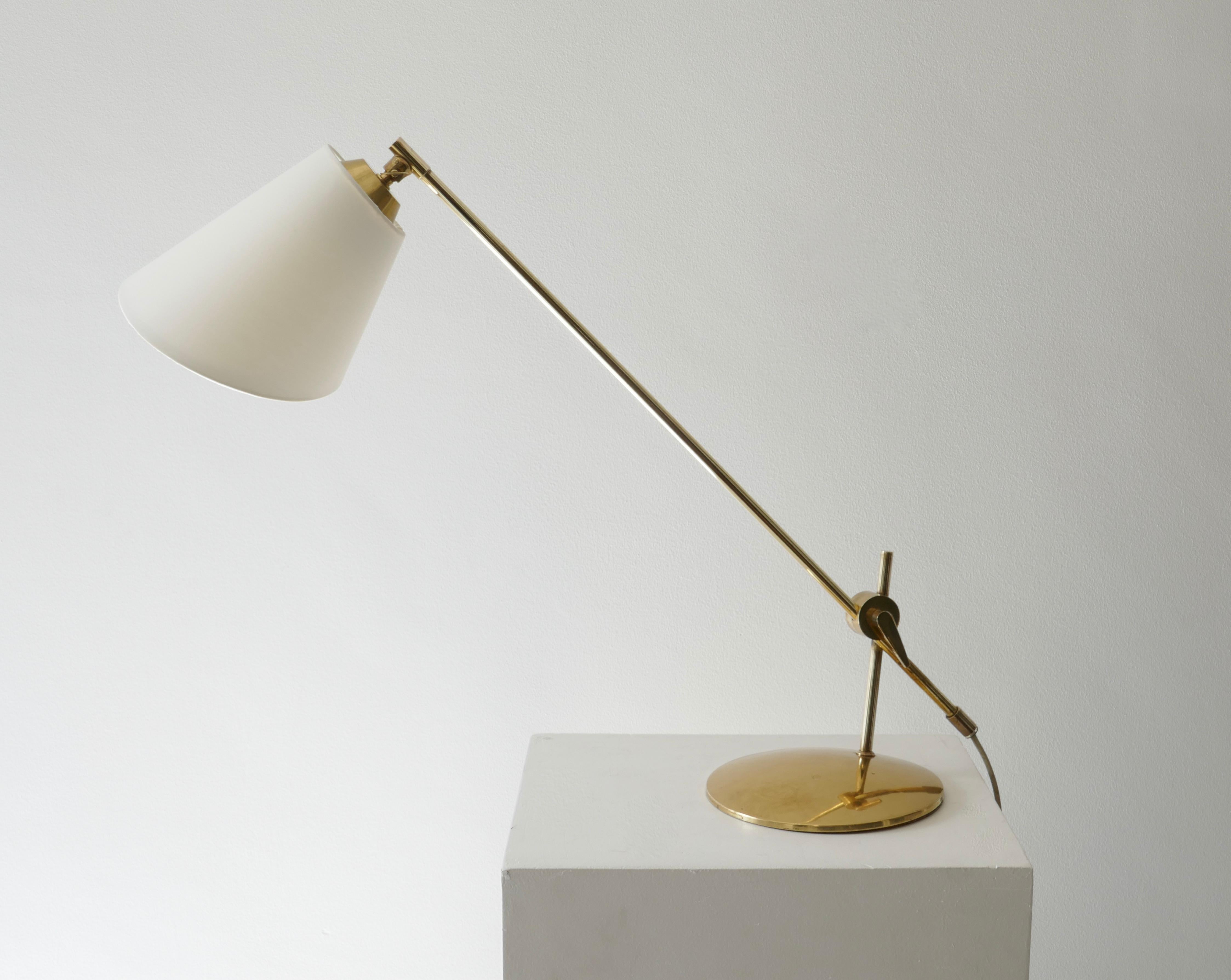 Adjustable brass table or desk lamp, attributed to Th. Valentiner for Povl Dinesen with white lamp shade, Denmark, 1960s.