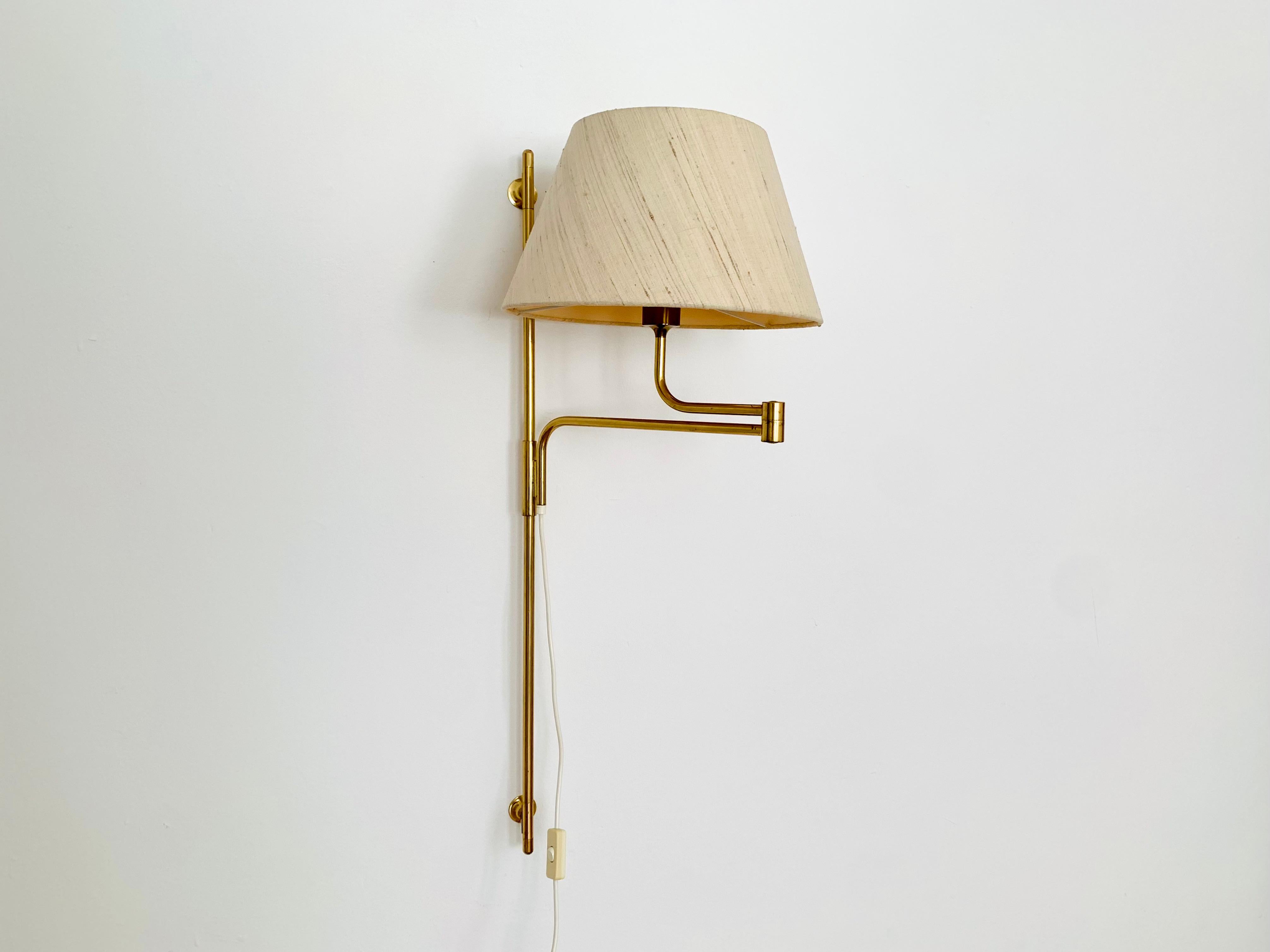 Mid-Century Modern Adjustable Brass Wall Lamp by Florian Schulz For Sale