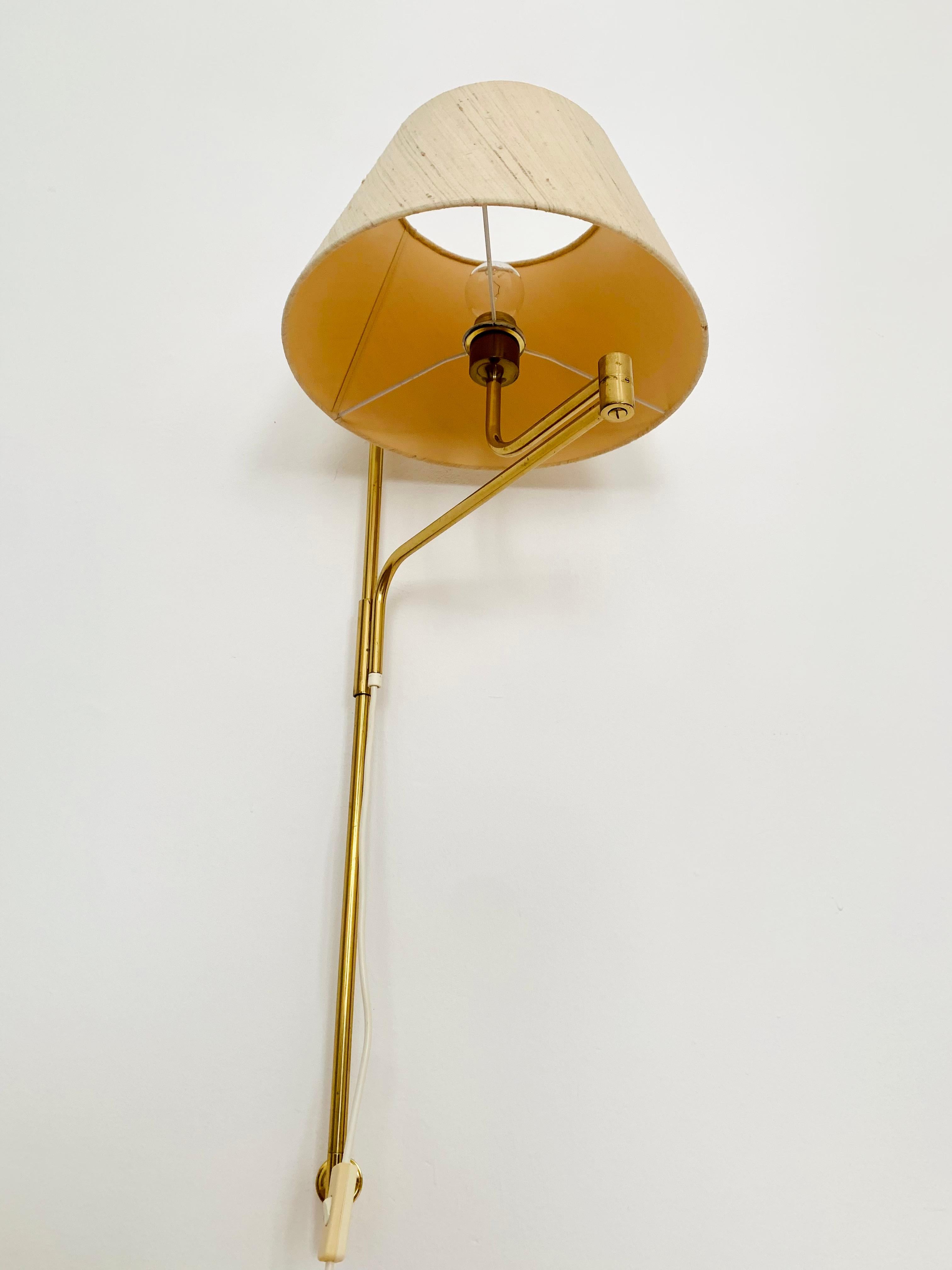 German Adjustable Brass Wall Lamp by Florian Schulz For Sale