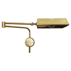 Adjustable brass wall lamp by Florian Schulz