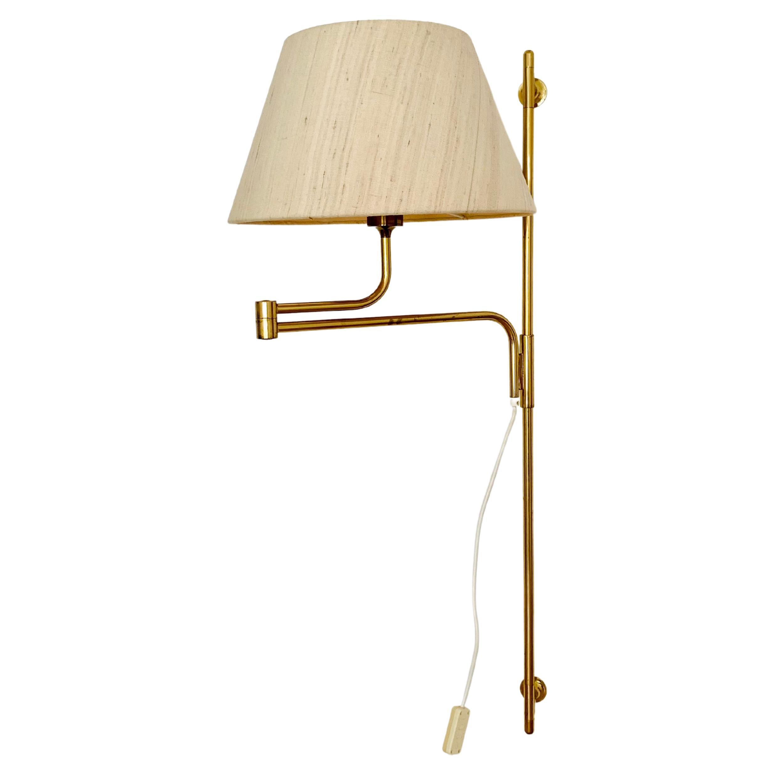 Adjustable Brass Wall Lamp by Florian Schulz For Sale