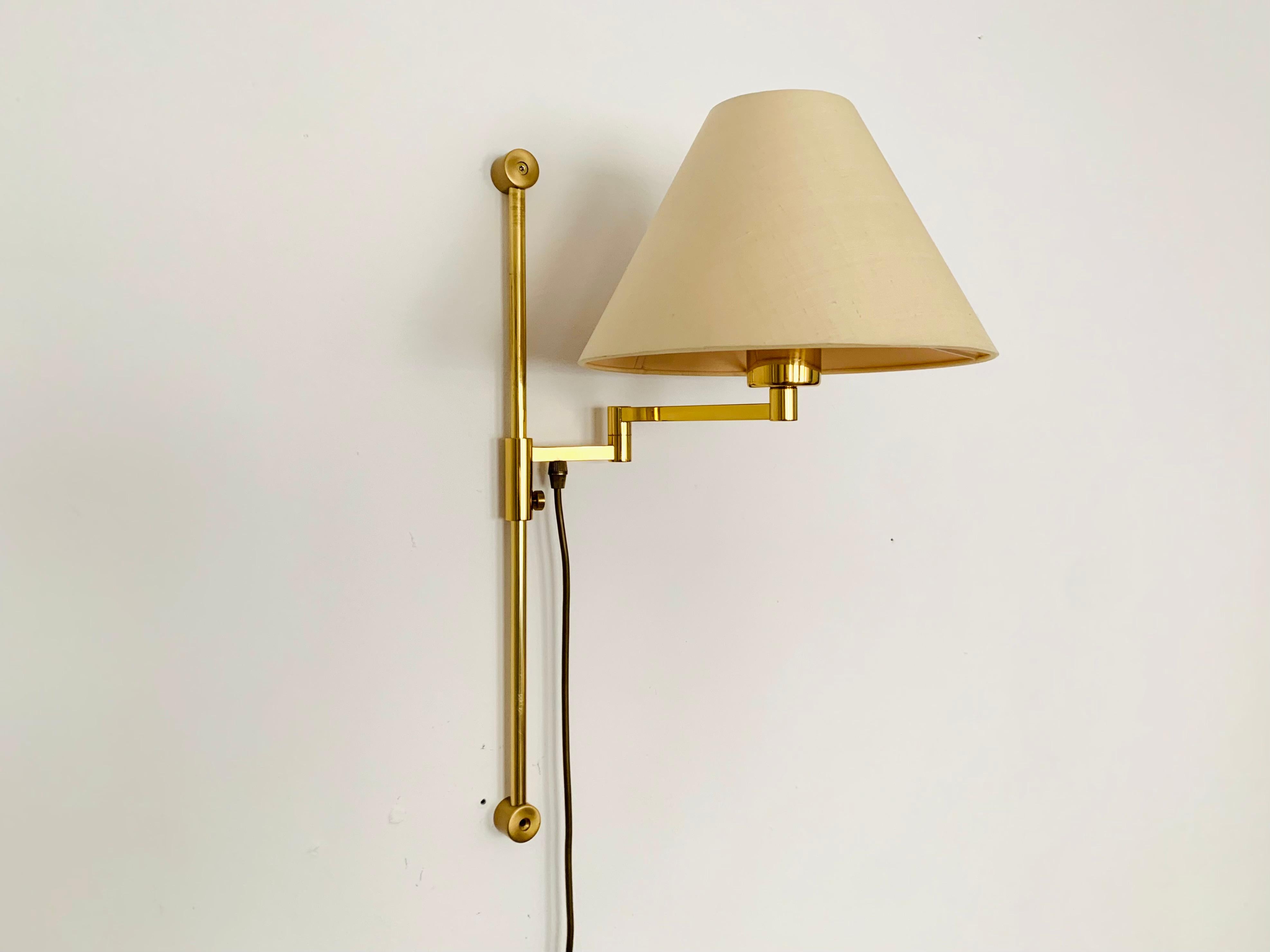 Very nice adjustable brass wall lamp from the 1960s.
The lighting effect of the lamp is extremely beautiful because the lampshade creates a very warm atmosphere.

Condition:

Very good vintage condition with slight signs of wear consistent with