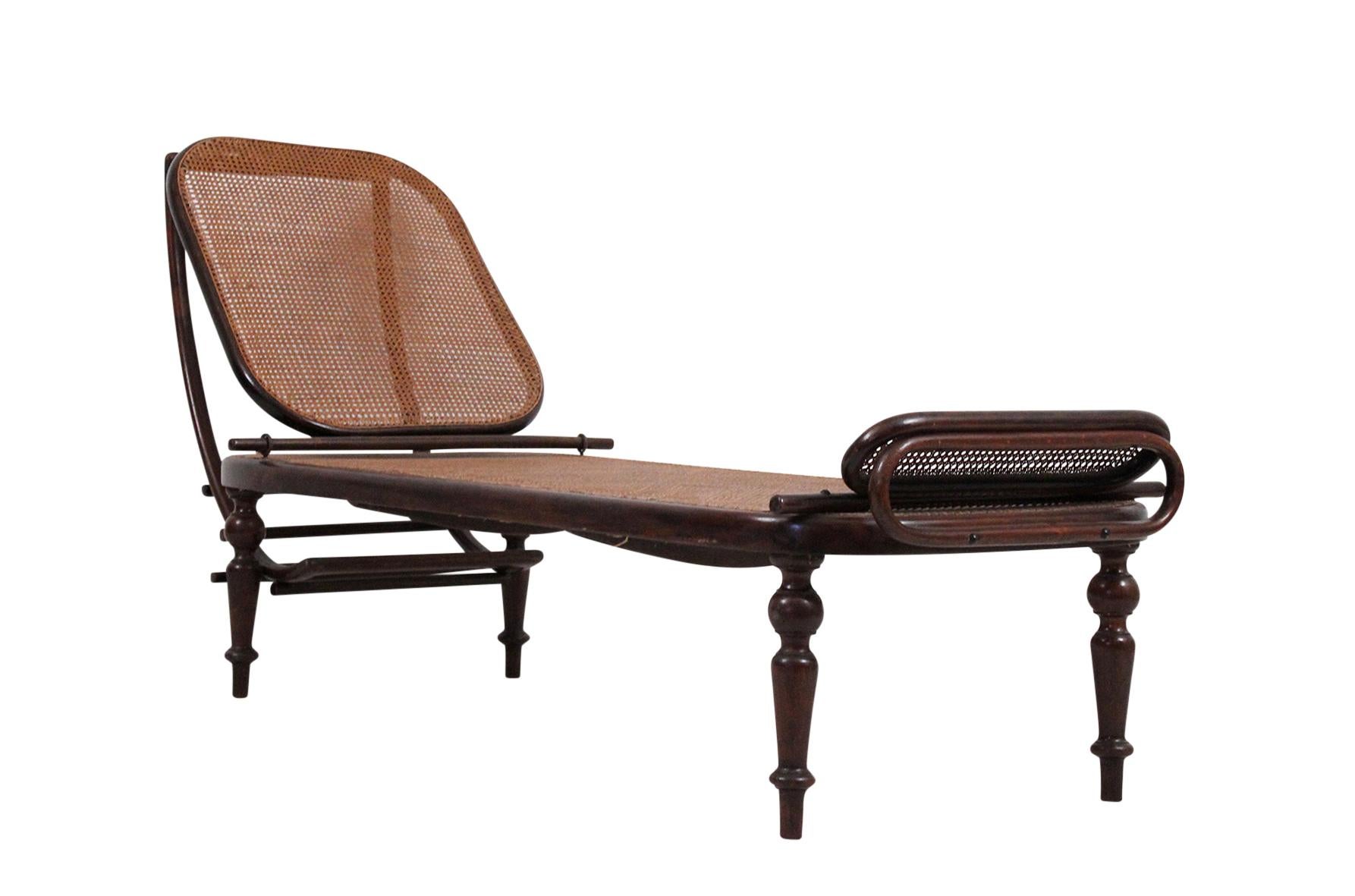Adjustable chaise lounge in stained beechwood. Manufactured by Gebrüder Thonet. Vienna, Austria, circa late 19th-early 20th century. This model was in production between 1887-1910. All original condition. Signed with Thonet brand to underside.
 
