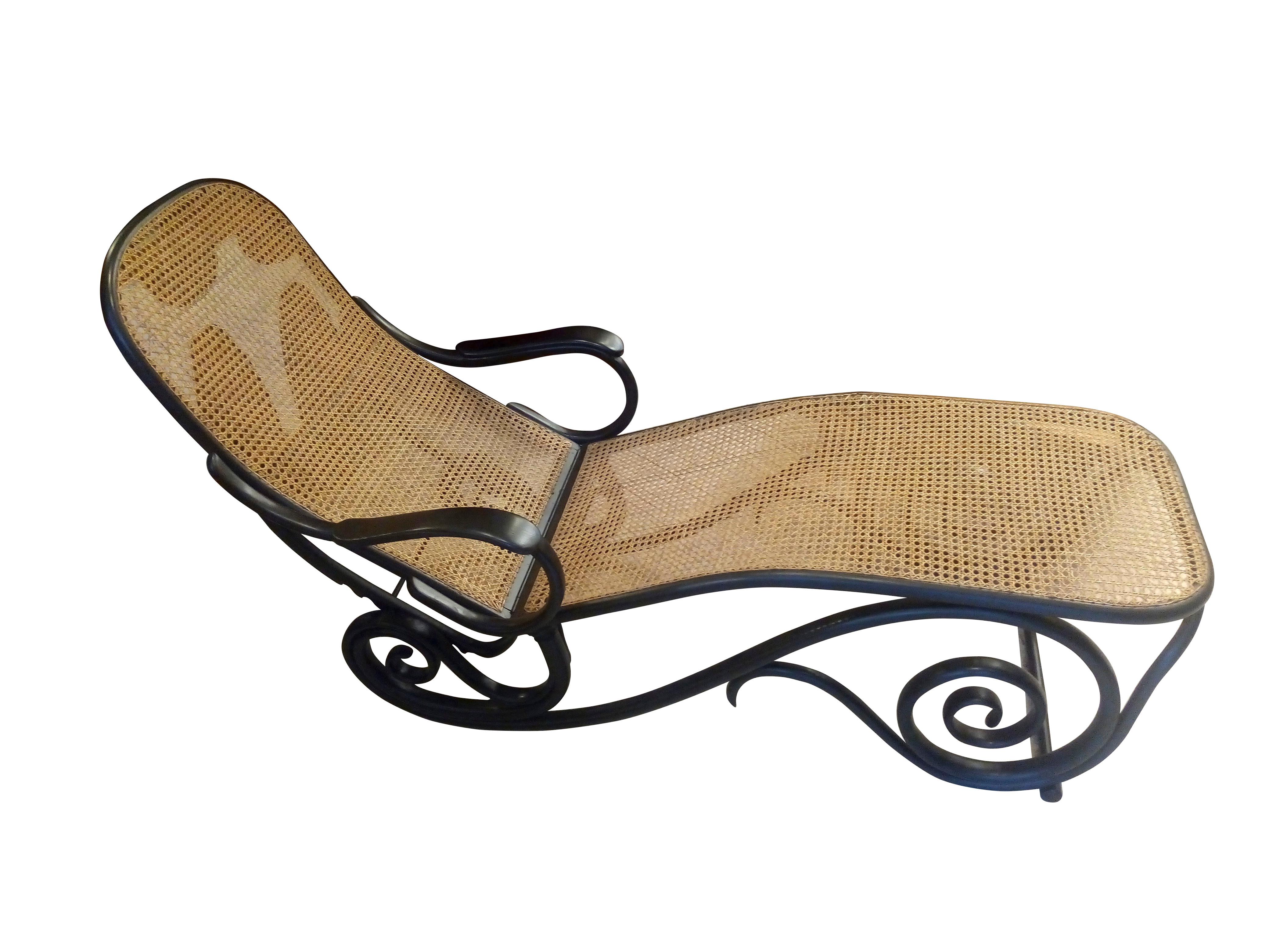 Amazing and comfortable adjustable lounge chair in bent wood and cane manufactured circa 1900 in Austria by Thonet Gebruder (Thoner Brothers) Company. The back rest has 6 adjustable positions for maximum comfort and versatility. Ideal for resting