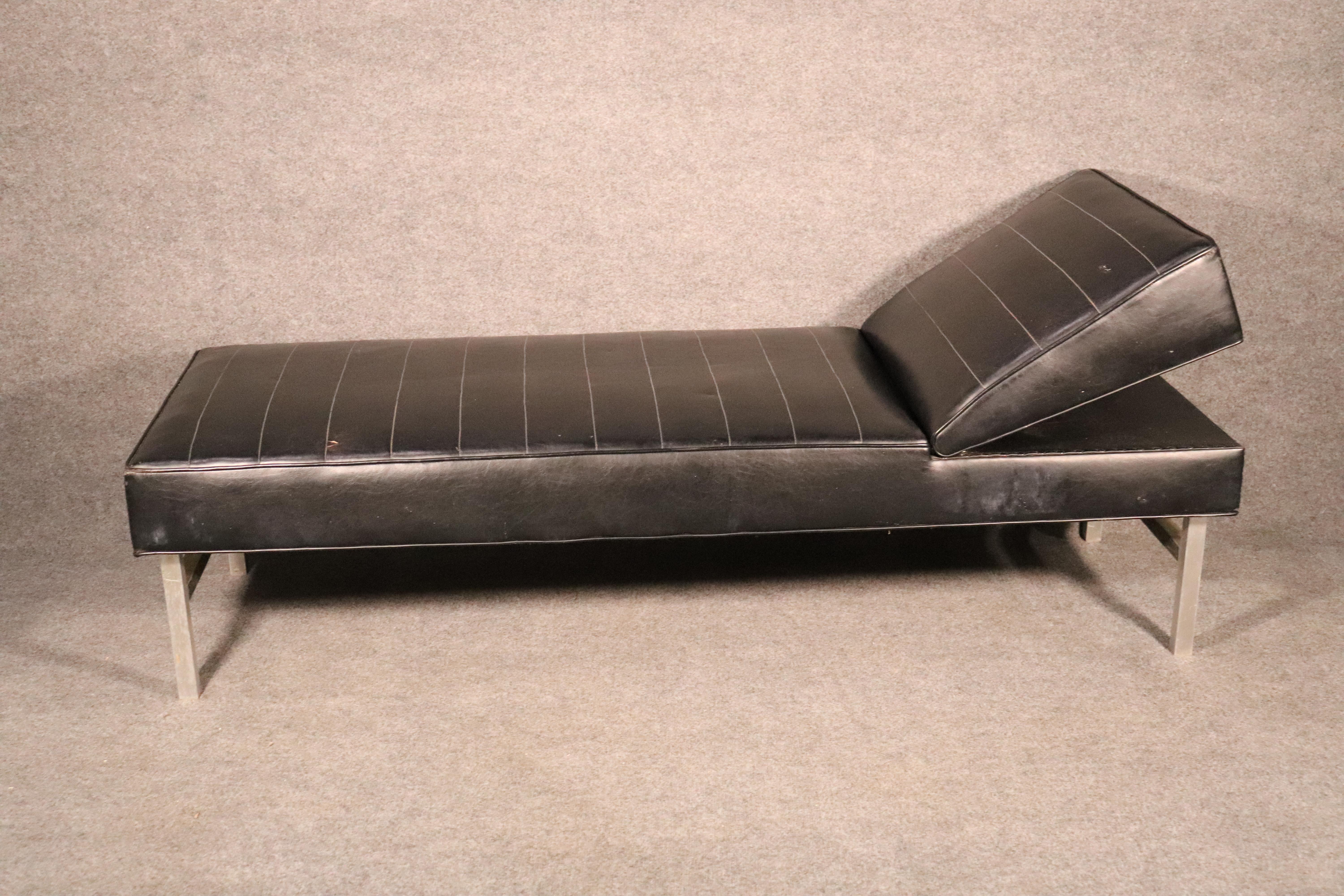 Long leather chaise lounge with adjustable headrest. Black leather on metal frame gives a comfortable lounging chair.
Headrest: 24-30.75