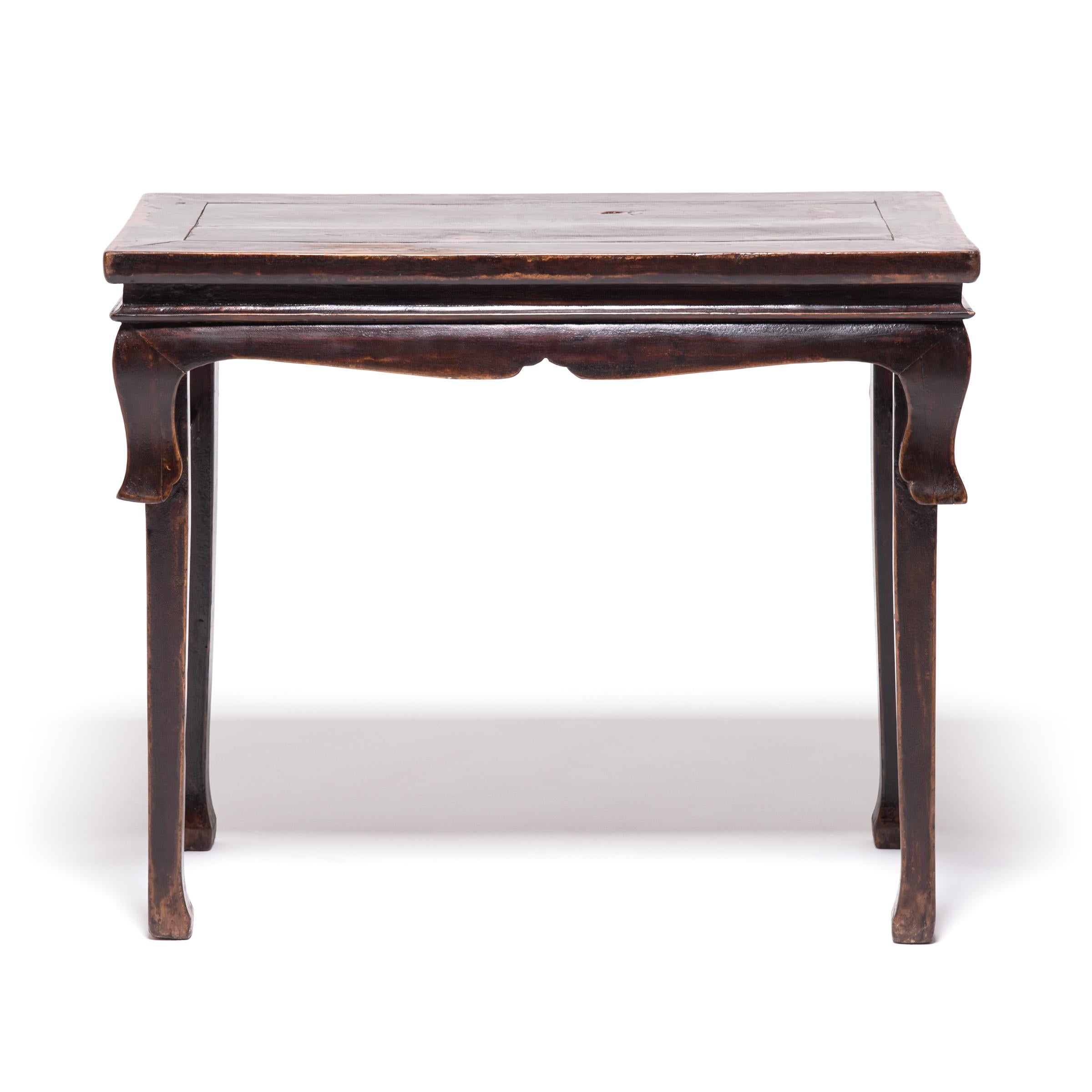 This petite 19th century console table crafted in China's Shanxi province is the perfect example of Qing-dynasty ideals of scholarship and craftsmanship. Though its clean lines and rich lacquer finish may be beautiful, it was the versatility of this