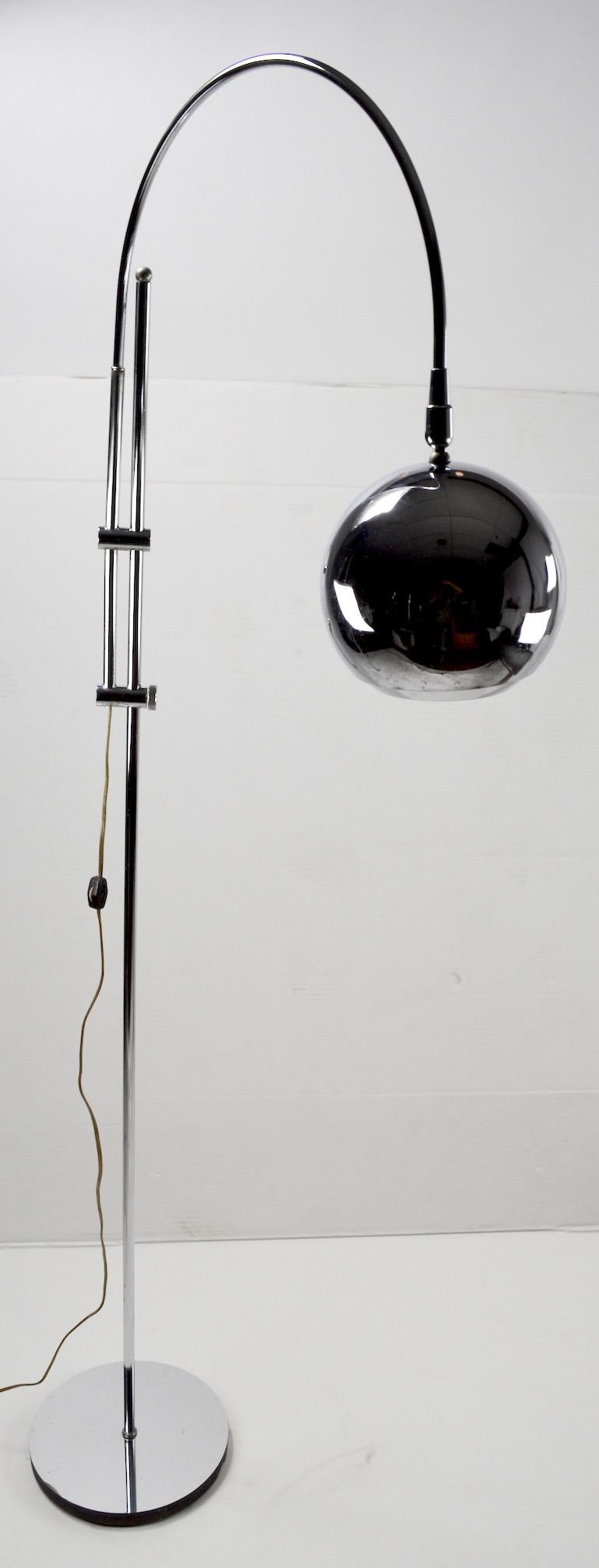 Nice quality adjustable chrome floor lamp. This floor lamp can be raised, lowered, the arc arm swivels, and the ball shade pivots , allowing for infinite adjustments to position the light exactly where you want it. Lamp accepts a standard screw in