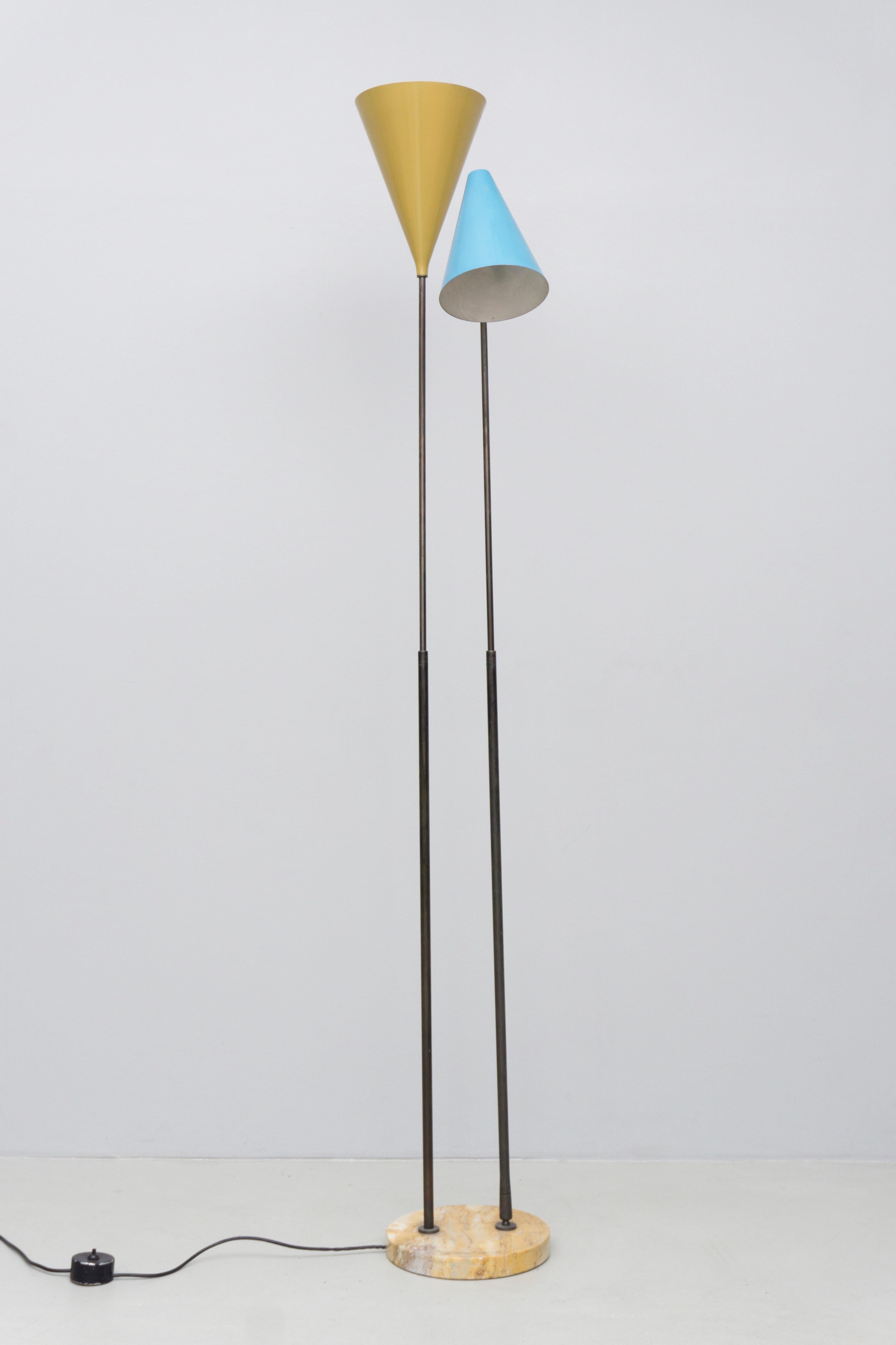 Two colored floor lamp with adjustable poles and reflectors, made of brass, lacquered aluminum and a marble foot. Original lacquering and light switch. Adjustable in height through a telescope like pole and in lighting direction through rotatable