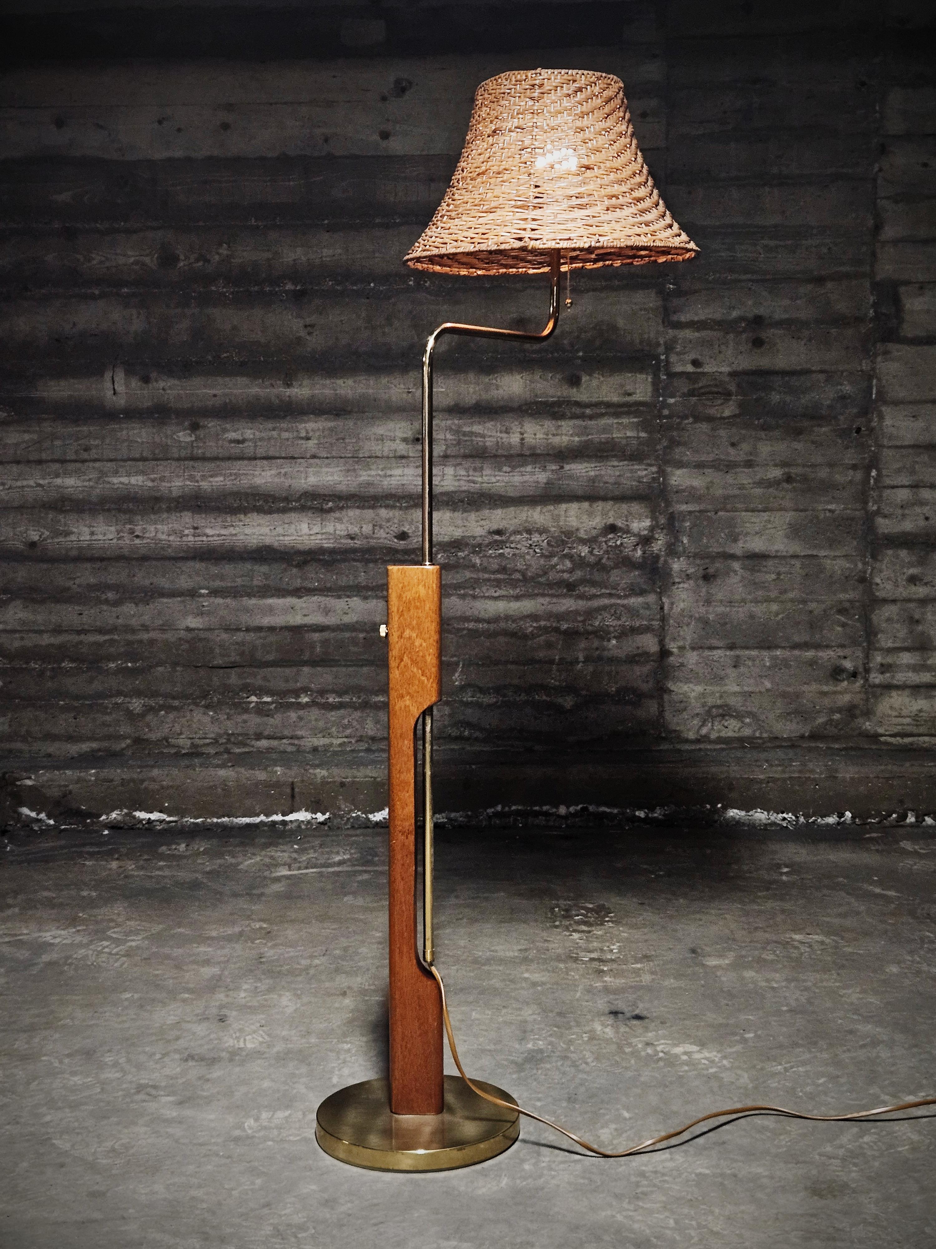 Bergboms luxurious model G-82A. Made in teak and brass, Sweden, 1960s. Adjustable hight between 109 to 136 cm without shade. 

Modern design with an element of typical Scandinavian design with its elements of teak and playfull lines. 

Similar to