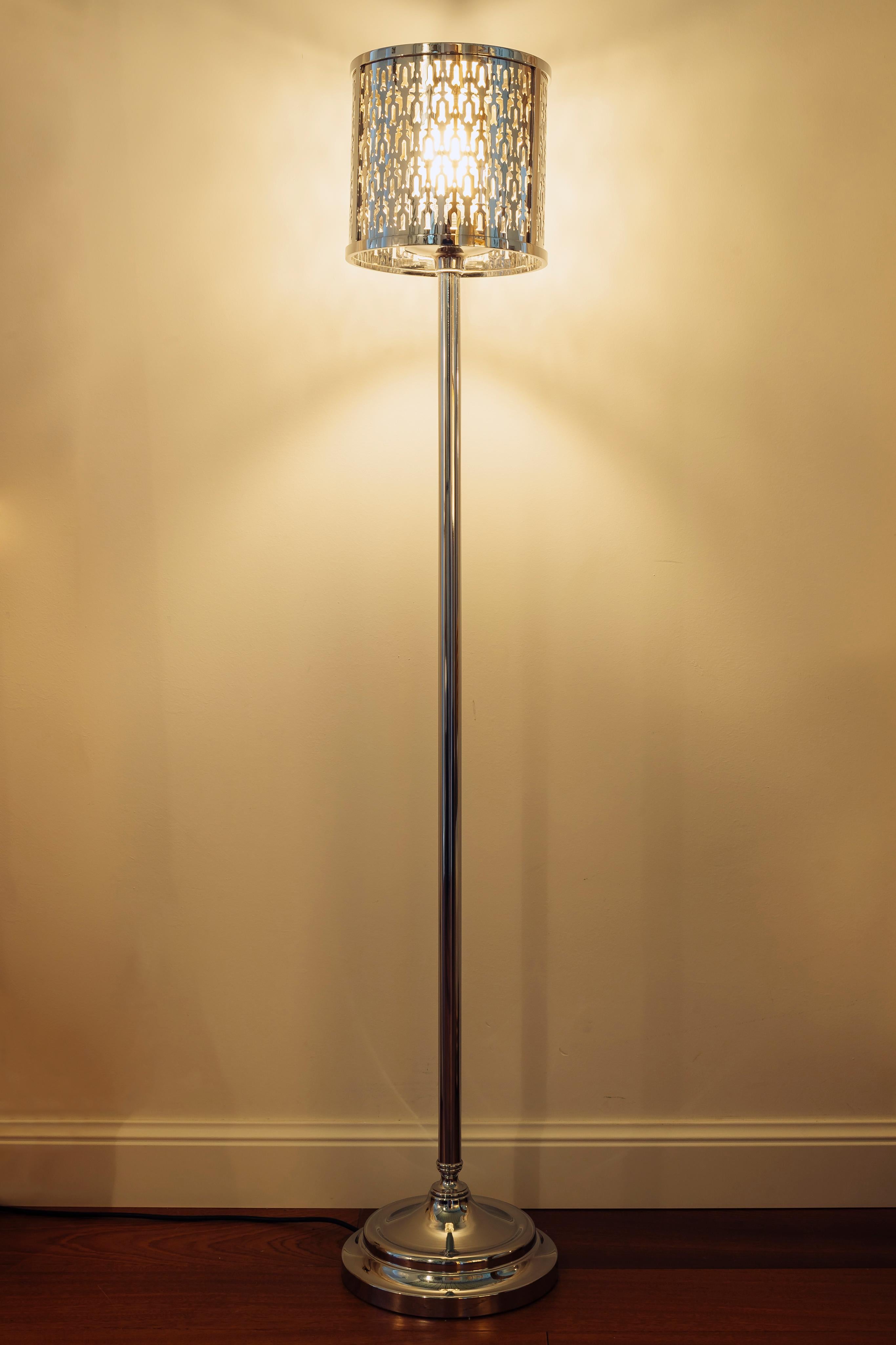 Studio 230 crome brass floor lamp with laser cut lampshade arabic style. It pertains to the Timeless collection in which classical objects, lamps and furniture coexist together with pieces reinterpreted in more contemporary shape. This floor lamp