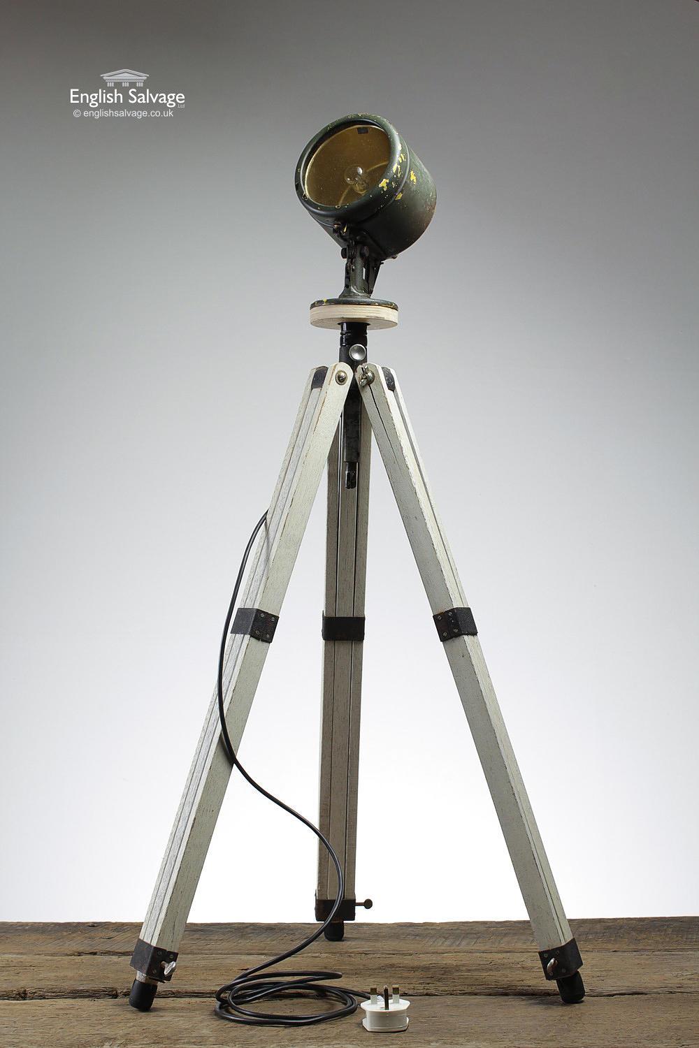 Reclaimed industrial floor light with a painted wooden extendable tripod base and a fully adjustable metal spotlight which has been rewired. The height can be adjusted roughly 98cm to 170cm high. The legs are a bit stiff to adjust and there are a