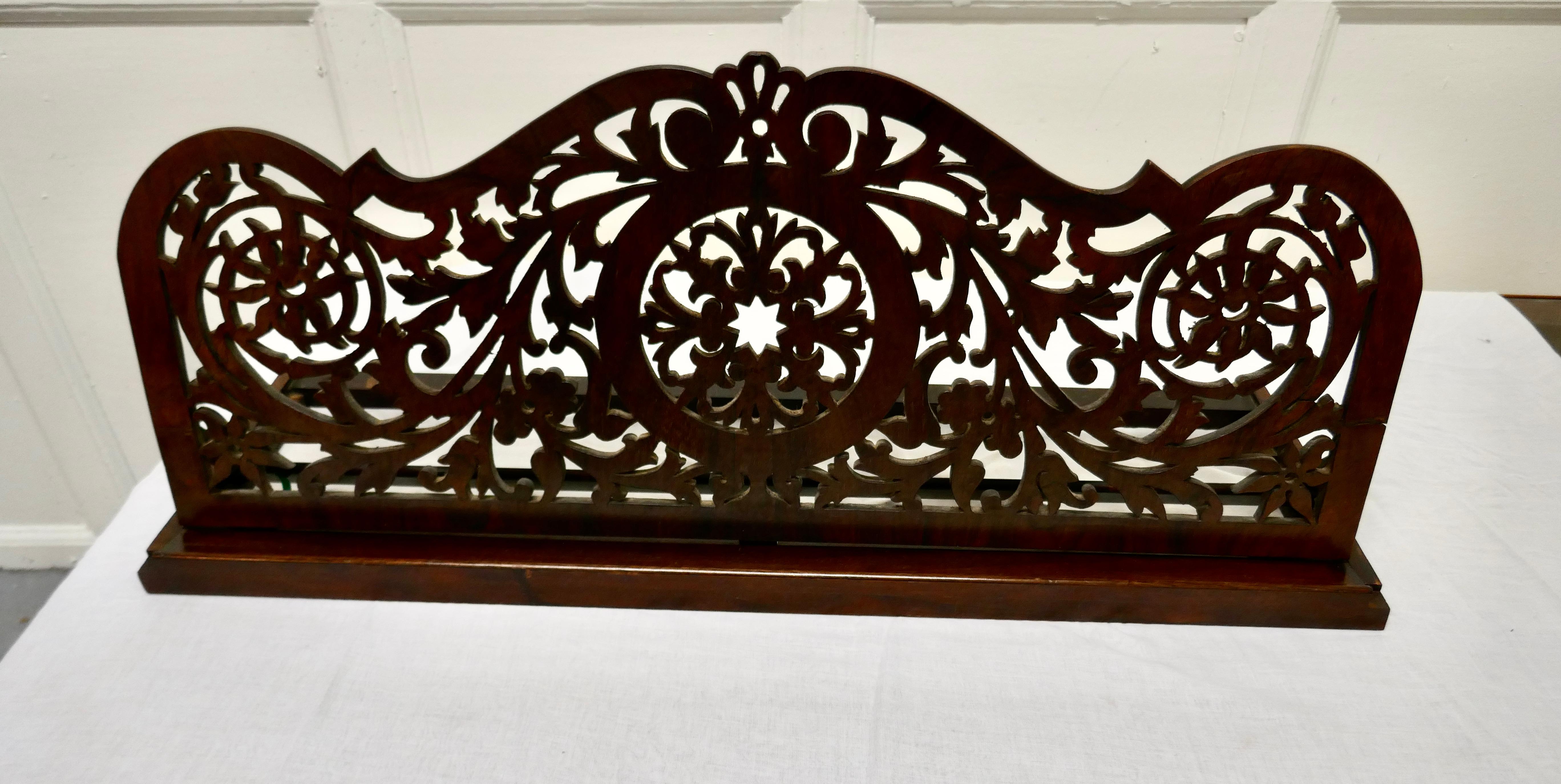 Adjustable Fretwork mahogany book rest or, Lutrin

This is a charming piece, it is larger than normal and made in beautifully figured walnut, it dates from the end of the 19th Century and has been superbly hand crafted by a skilful master.

The
