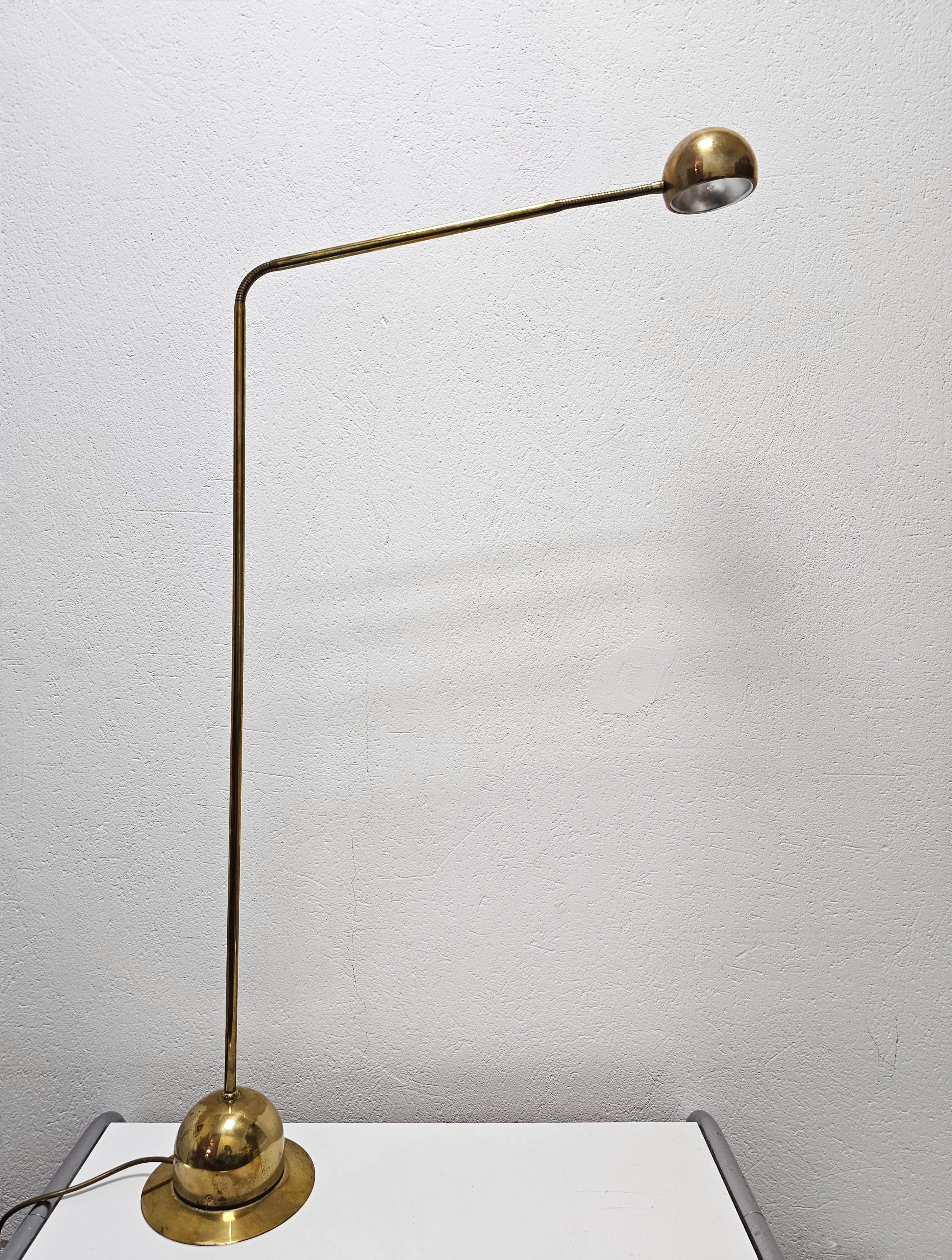 In this listing you will find an adjustable Mid Century Modern Floor Lamp. It's completely done in brass and features very elegant lines with gooseneck, that allows you to adjust the height and direction of the light. The head of the lump is also