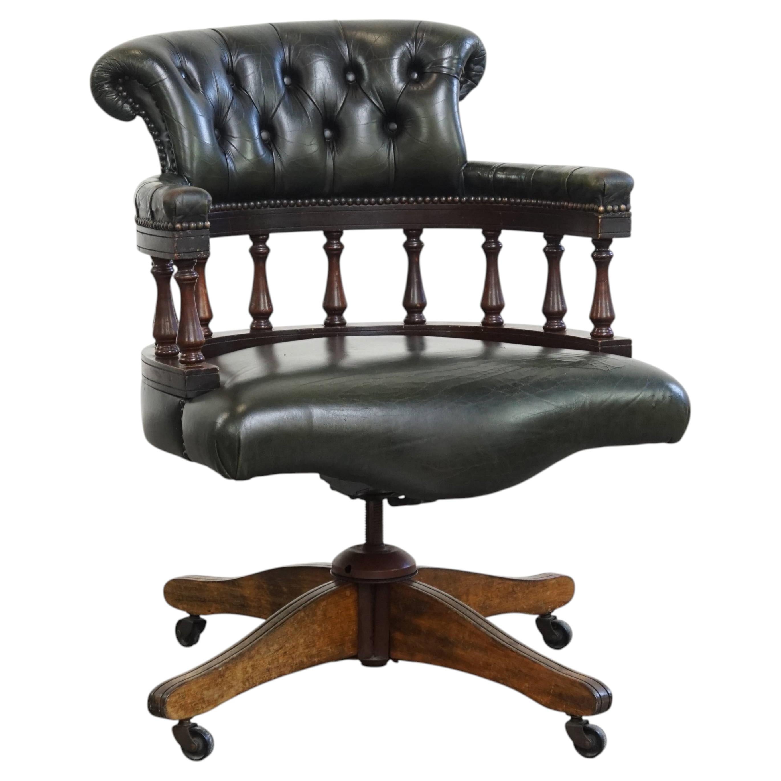 Adjustable green leather and wood Chesterfield office chair with swivel For Sale
