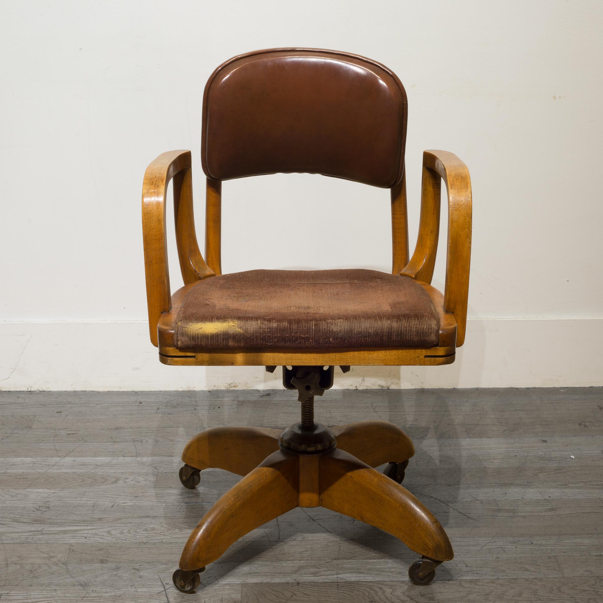 About

This is a solid oak, vinyl and fabric swivel desk chair with steel mechanisms. The chair's height is adjustable by spinning the chair up or down. The backrest reclines and the tension can be adjusted. The height of the backrest can be raised