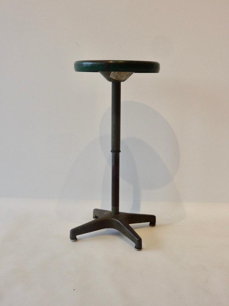Round top steel swivel stool. Seat adjusts from height of 18.5 to 27.5.