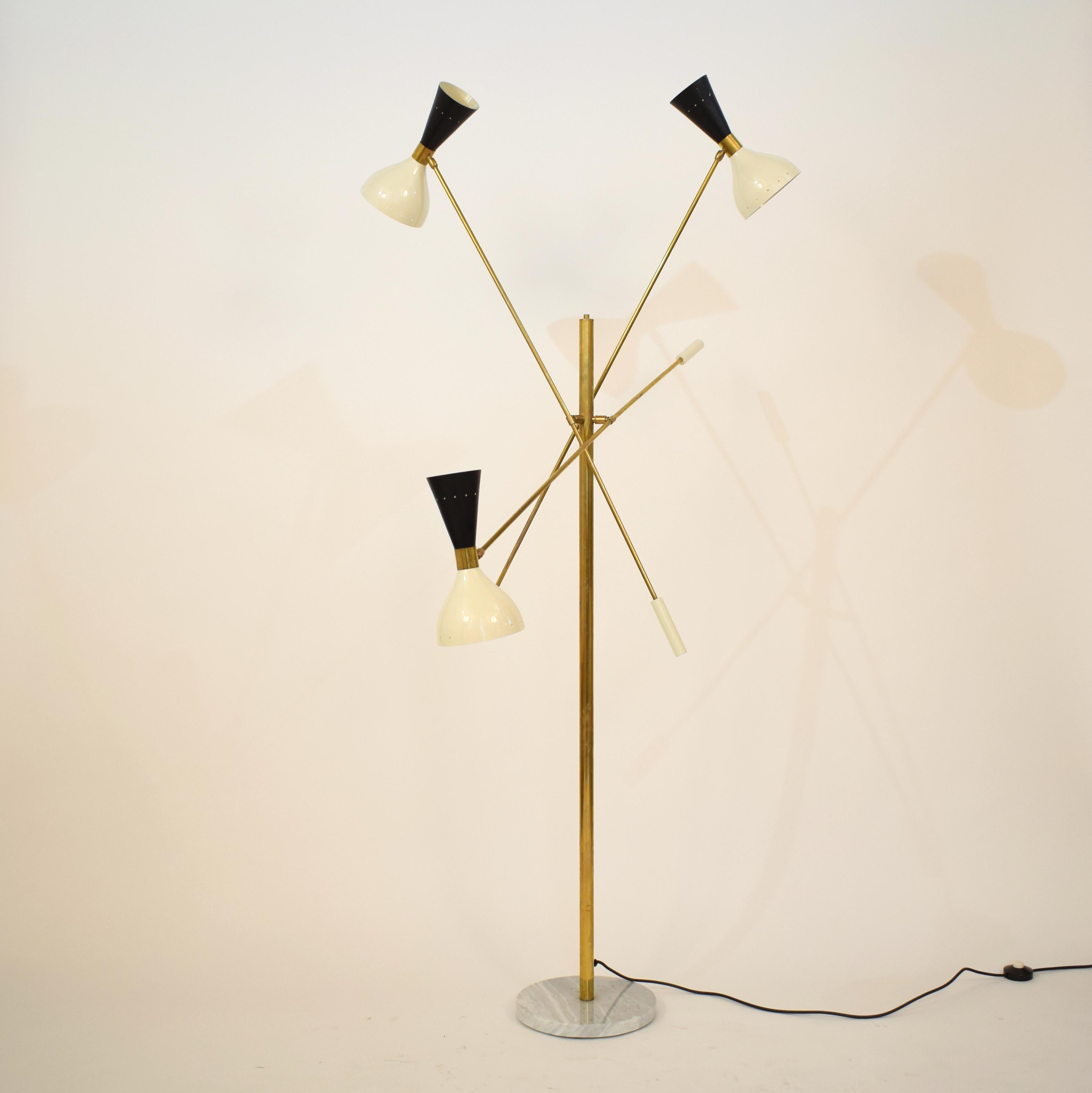 This beautiful adjustable Italian floor lamp has a white marble base, brass and lacquered black and white metal shades. It has adjustable arms and end parts.
Each one for an E27 and a E14 bulb.
