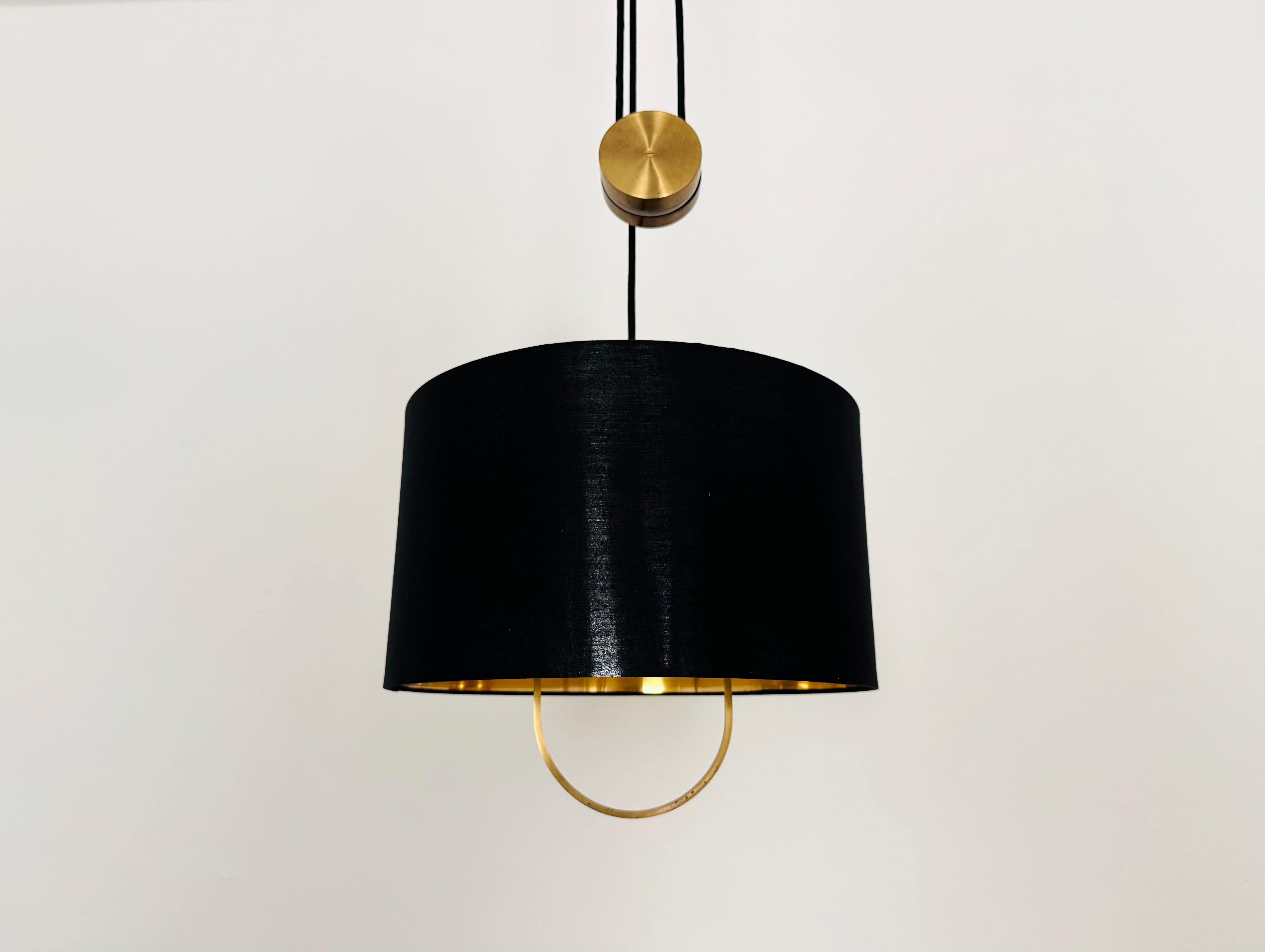 Beautiful brass Jo-Jo pendant lamp from the 1970s.
The lamp's lighting effect is exceptionally beautiful.
The design and the unique lampshade create a very elegant and pleasant light.
The lamp creates a very cozy atmosphere and is of very high